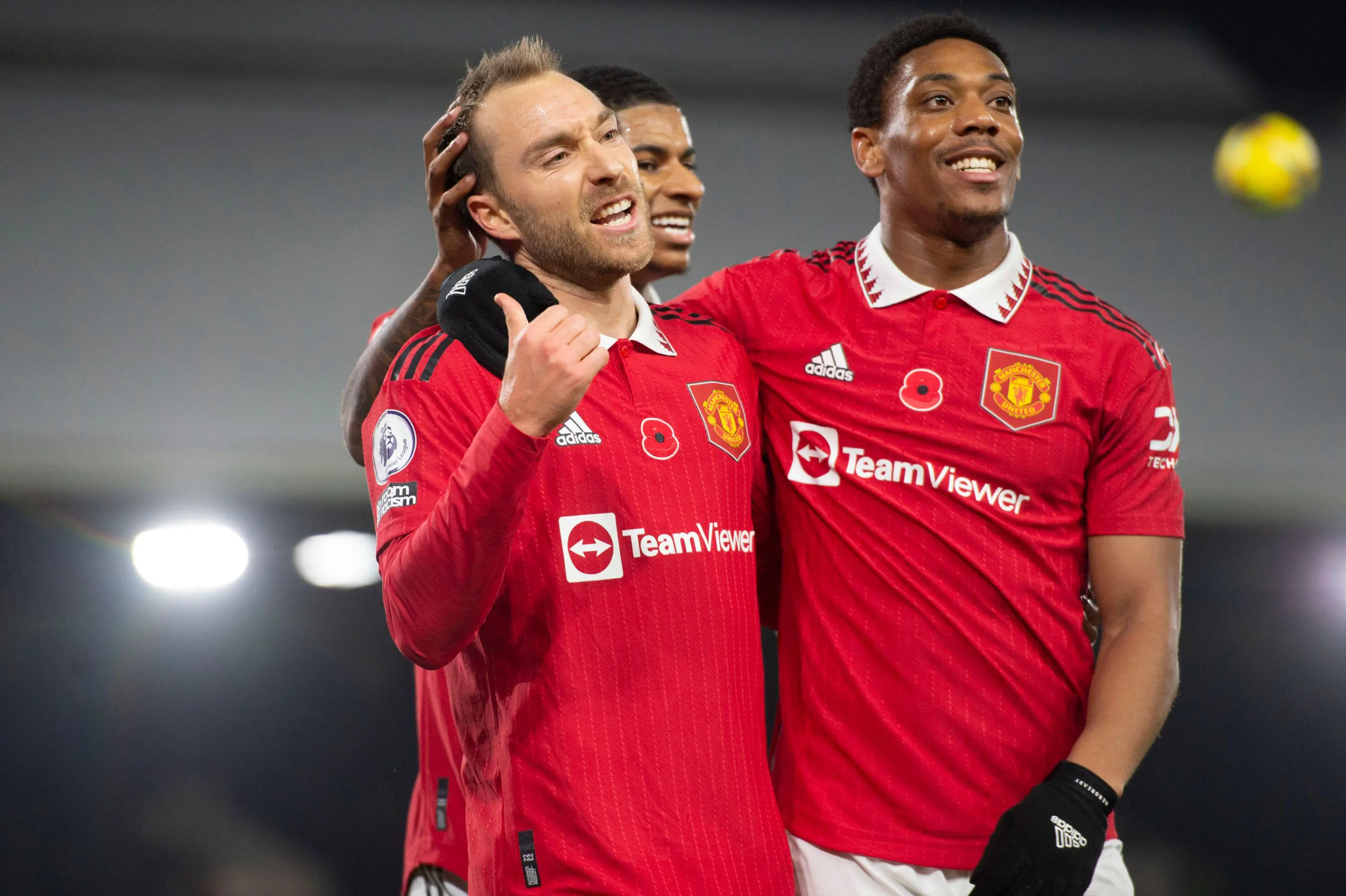 Eriksen celebrates his goal with Marcus Rashford and Anthony Martial. (Image