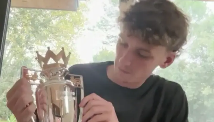 Morton with the gift he received from Liverpool following their title win last season. Image credit: SPORTbible