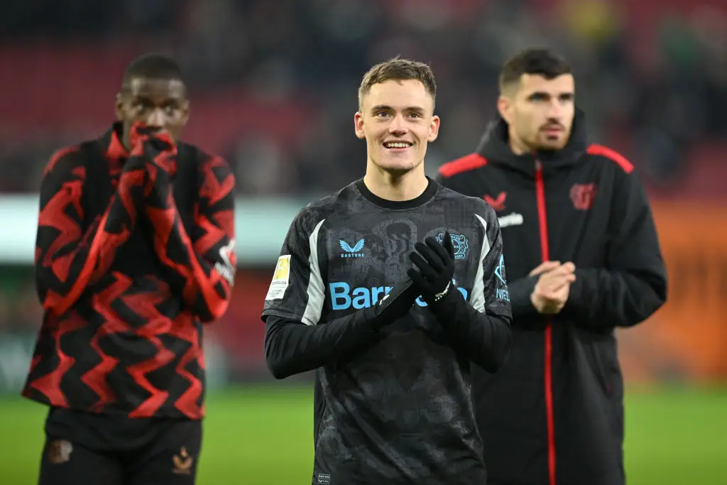 Florian Wirtz applauds Leverkusen fans after an away win over FC Augsburg (Image: Getty)