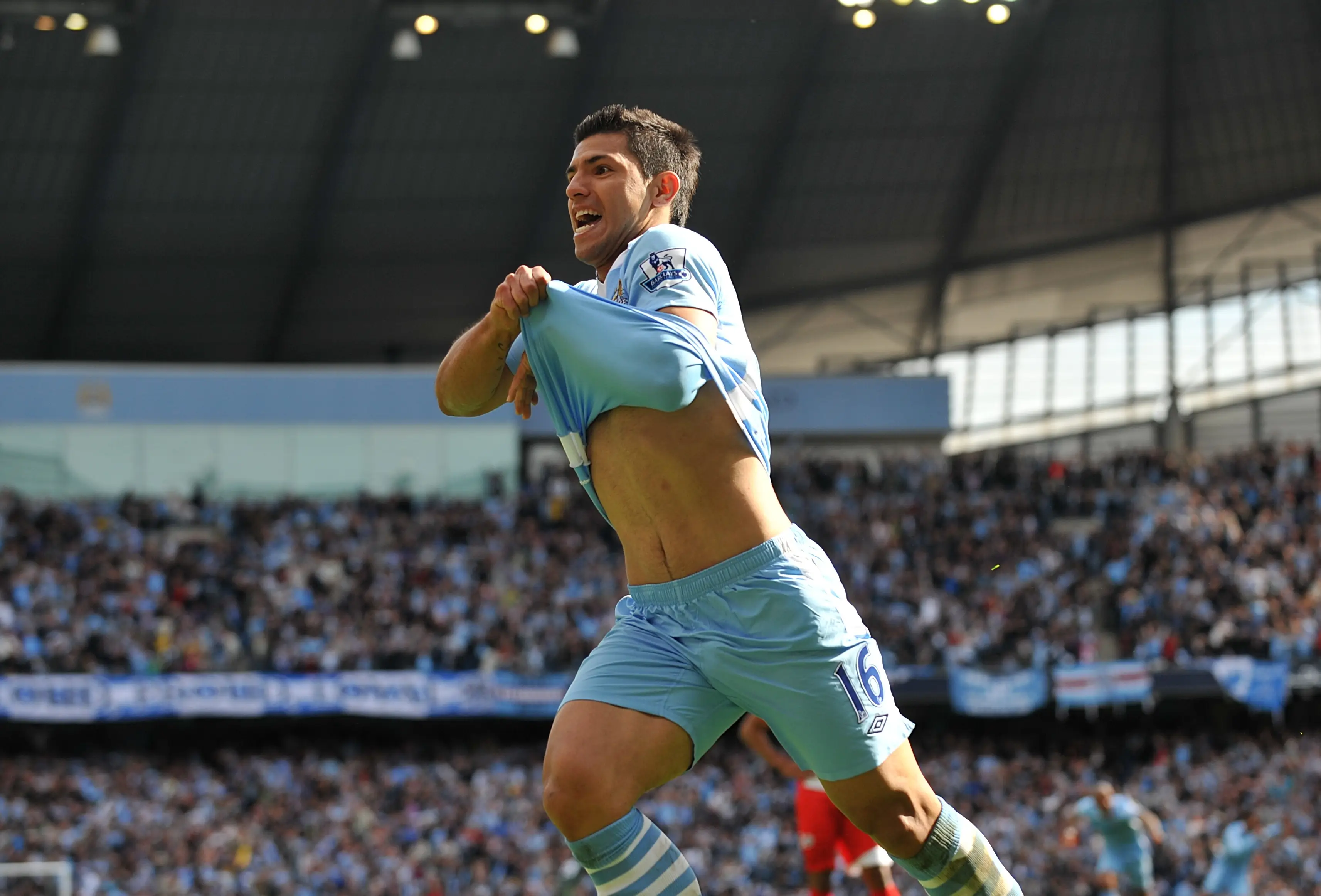 Sergio Aguero wheels in celebration after scoring a legendary goal. Image: Getty