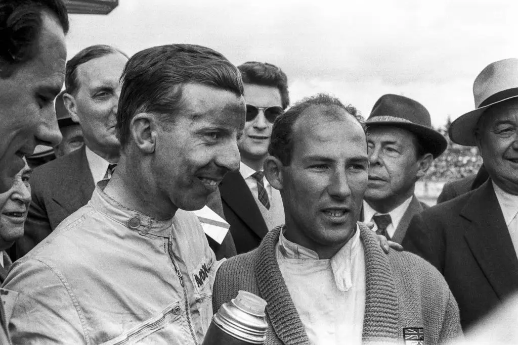 Stirling Moss (right) pictured at the 1958 German GP (Image: Getty)