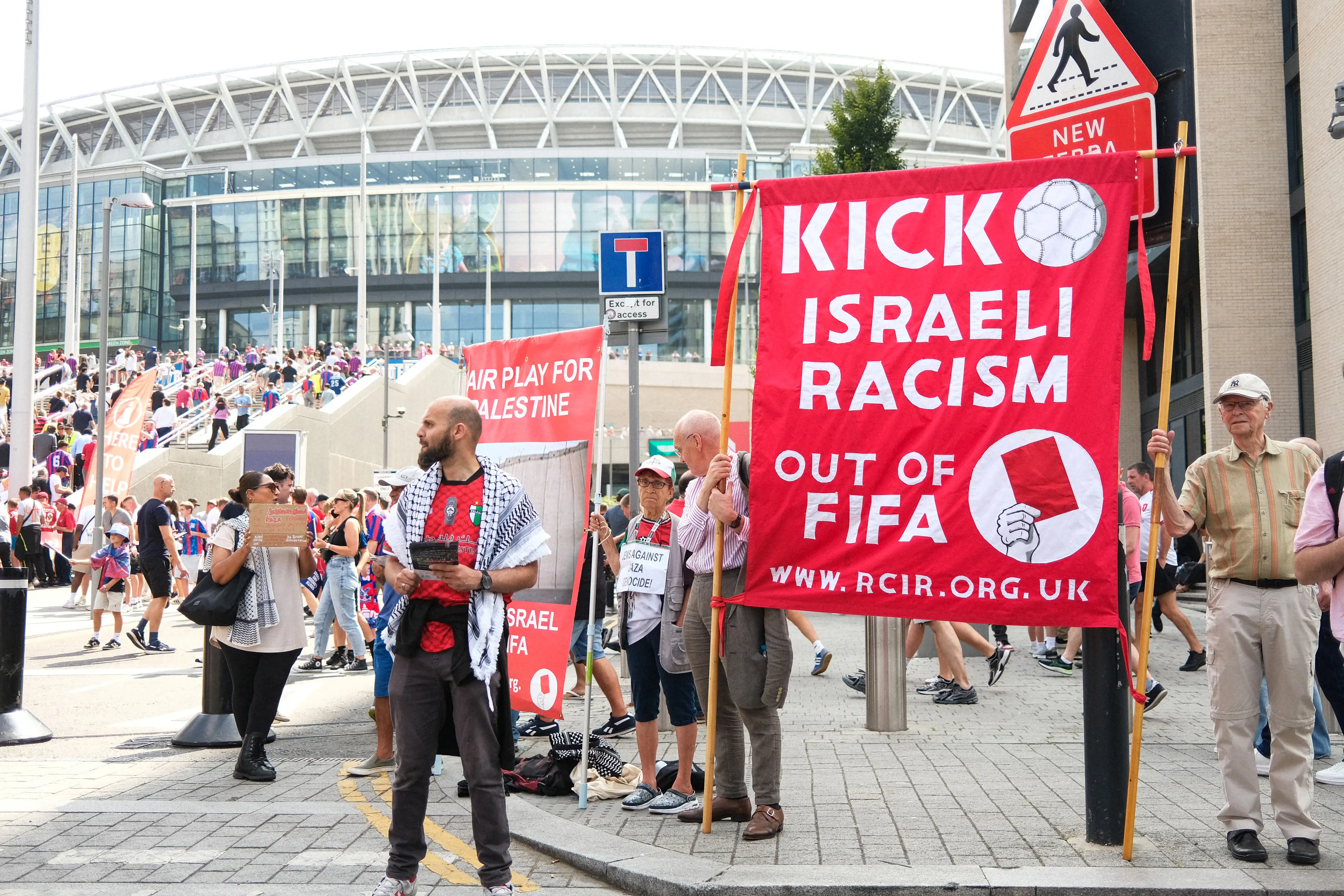 A sign outside Wembley calls for Israel to banned by FIFA. Image: Getty