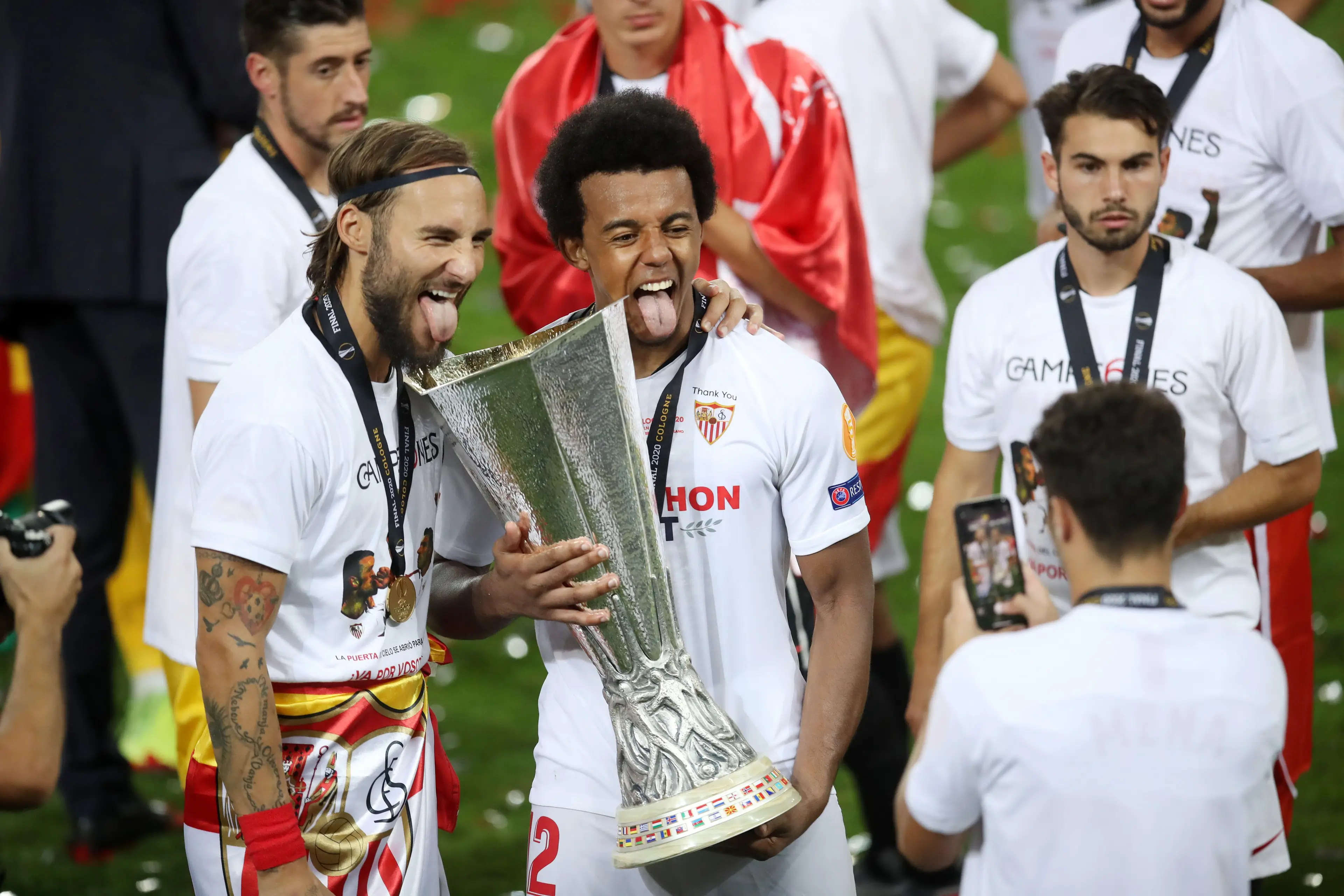 Jules Kounde poses for a photo with the UEFA Europa League Trophy. (Alamy)