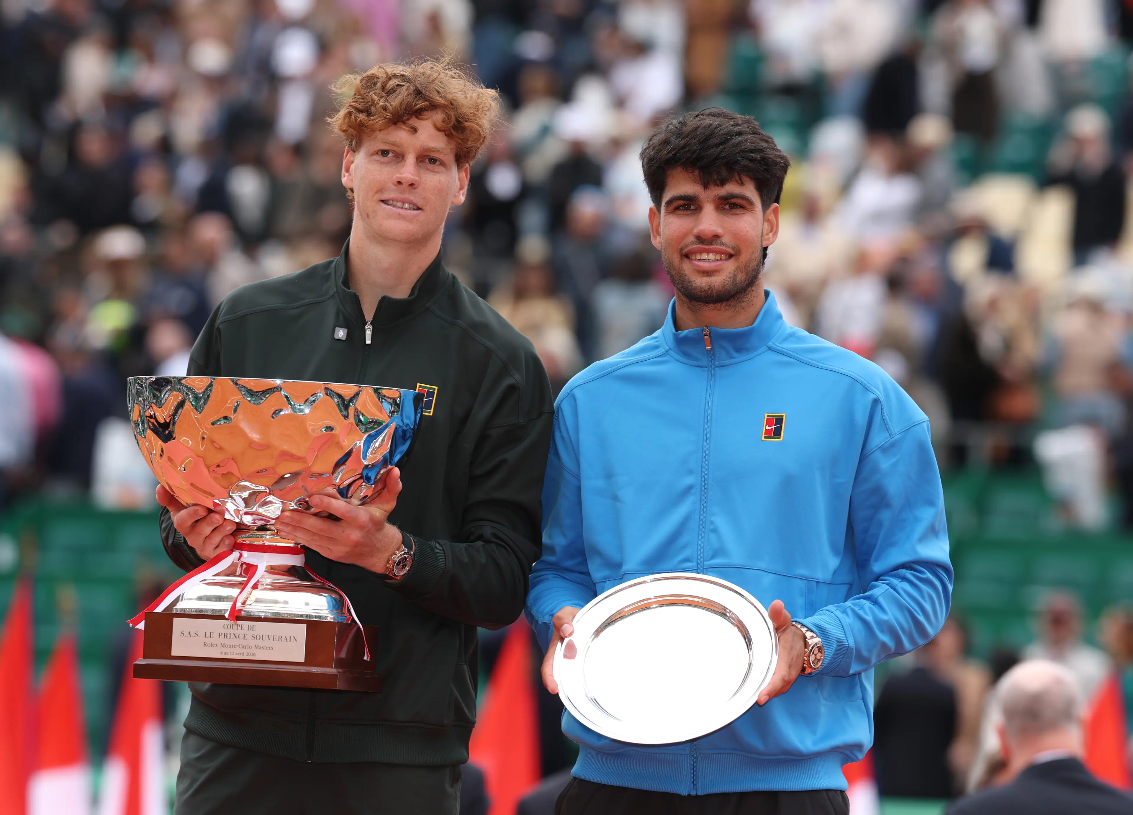 Jannik Sinner of Italy and Carlos Alcaraz of Spain pose for a photo with their winners and runners-up trophies after the Men's Singles Final (Getty Images)