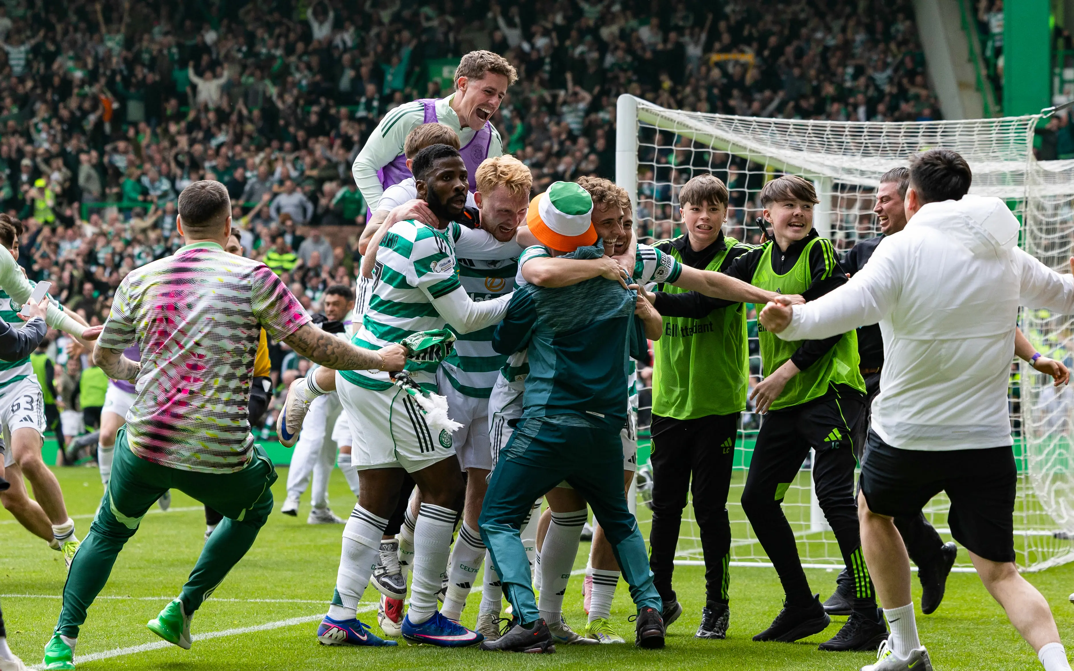 Celtic fans celebrated on the pitch after Callum Osmand made it 3-1 in stoppage time. Image credit: Getty