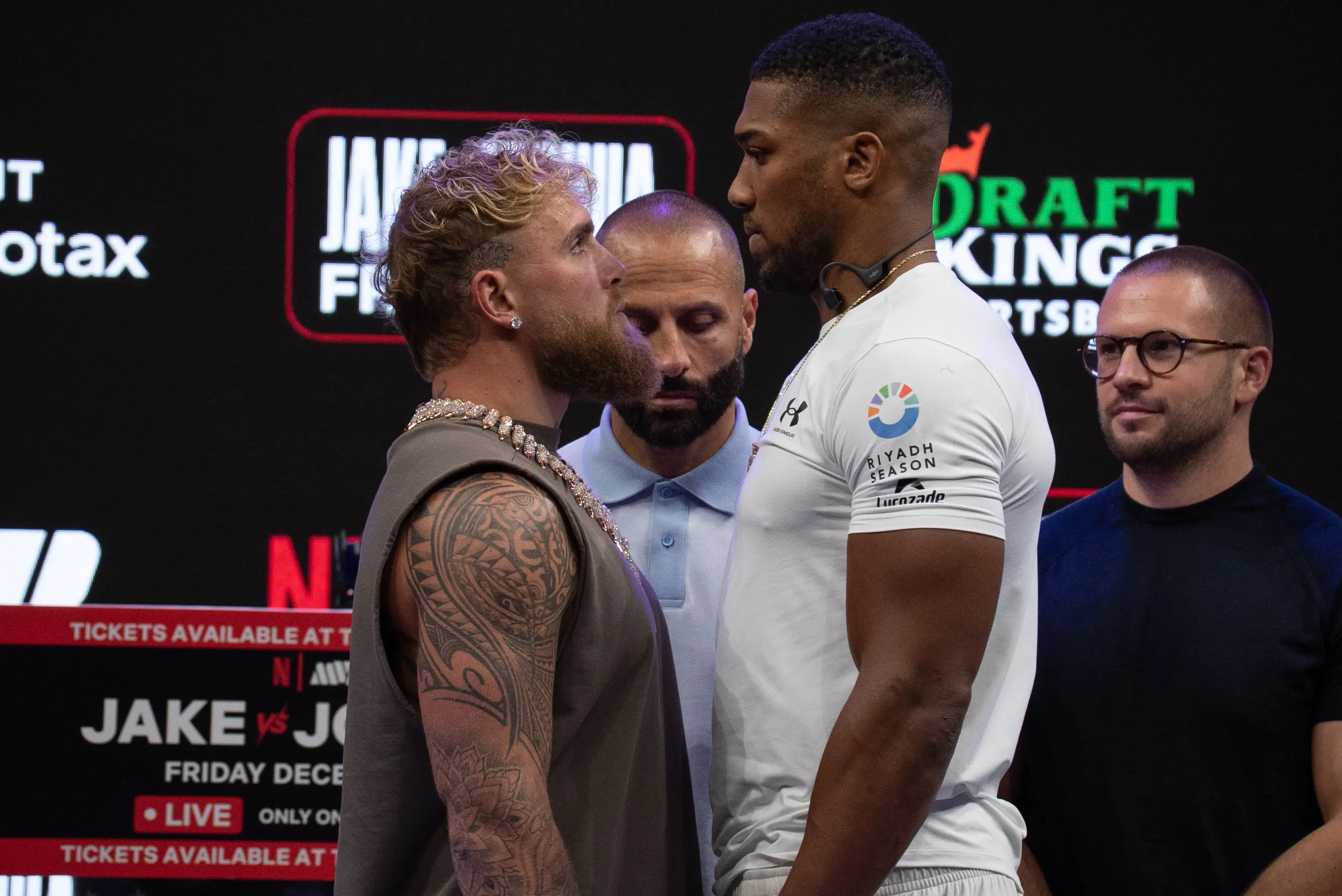 Jake Paul and Anthony Joshua go head-to-head at the launch press conference. Image: Getty 