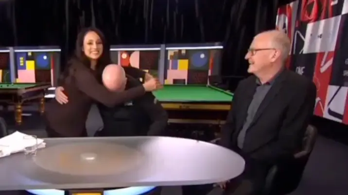 Snooker star John Higgins breaks down in tears on live TV and has to be consoled by BBC presenter