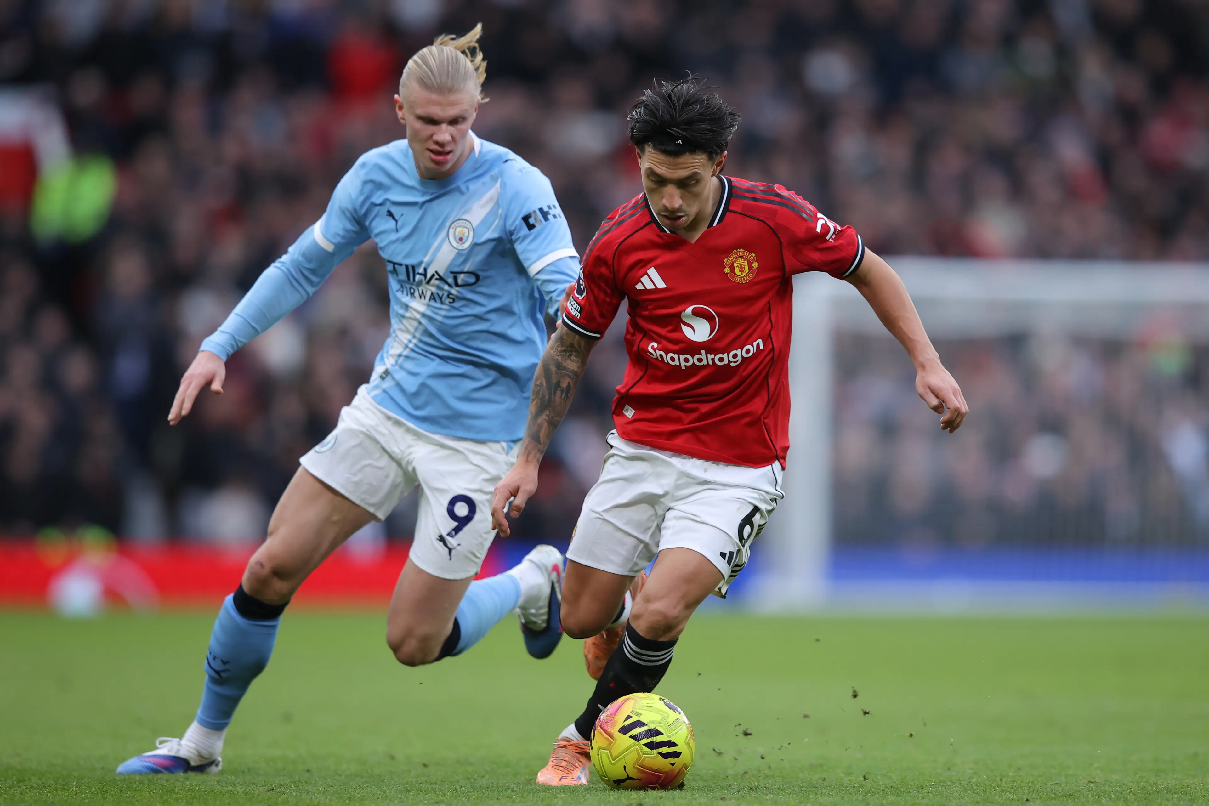 Lisandro Martinez and Erling Haaland during the Manchester derby. Image: Getty 