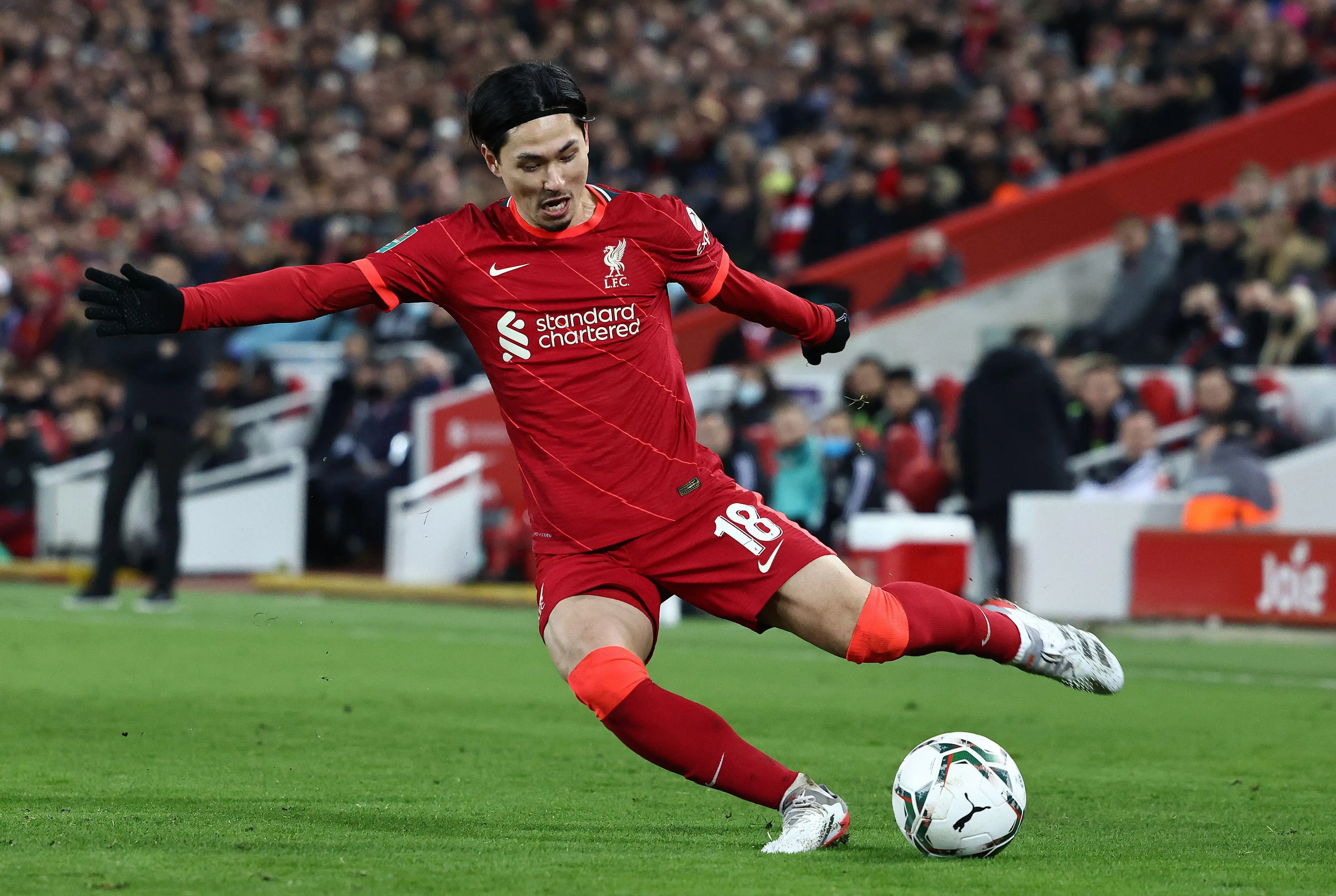 Takumi Minamino playing for Liverpool.