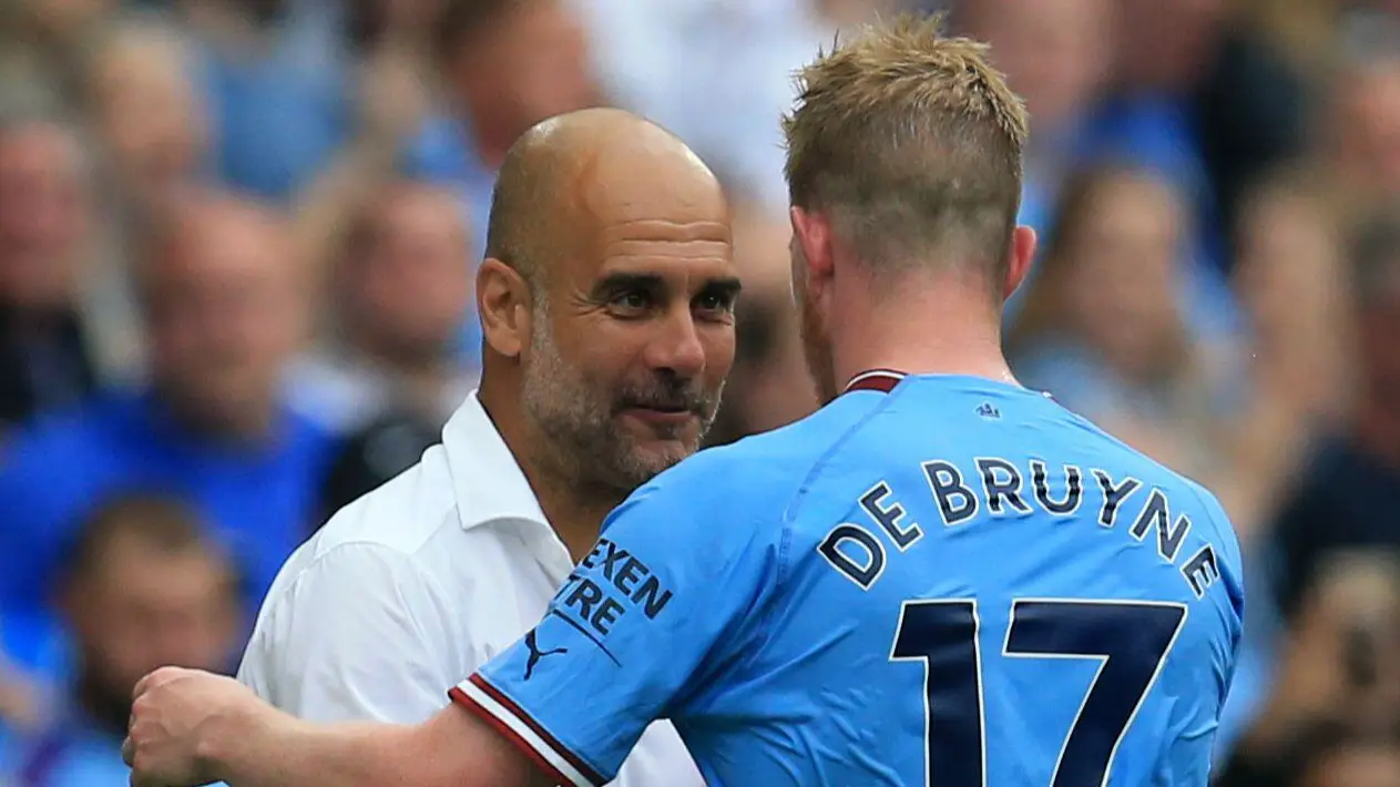 Manchester City's Kevin De Bruyne with Pep Guardiola.