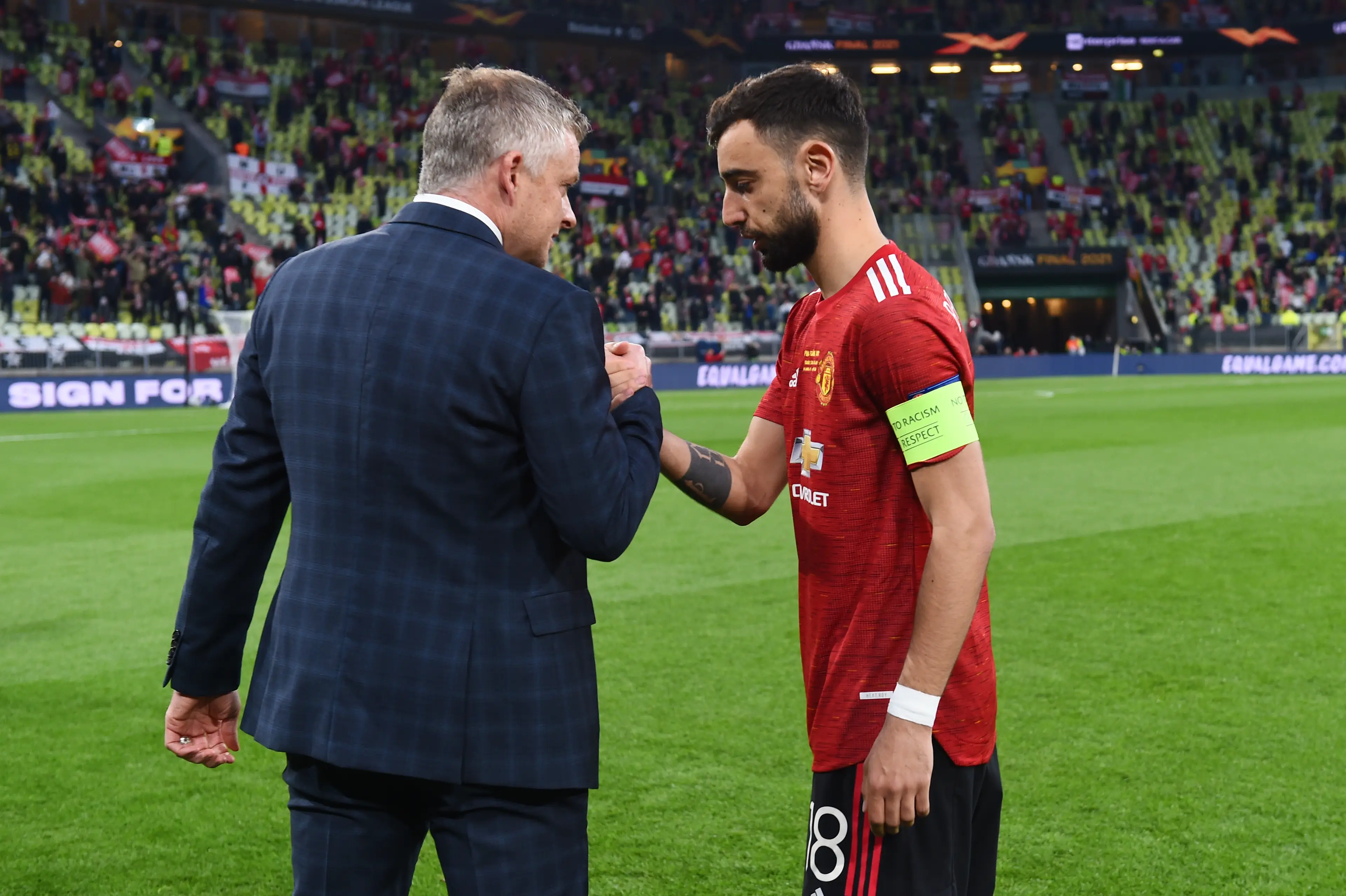 Ole Gunnar Solskjaer and Bruno Fernandes share a warm embrace. Image: Getty