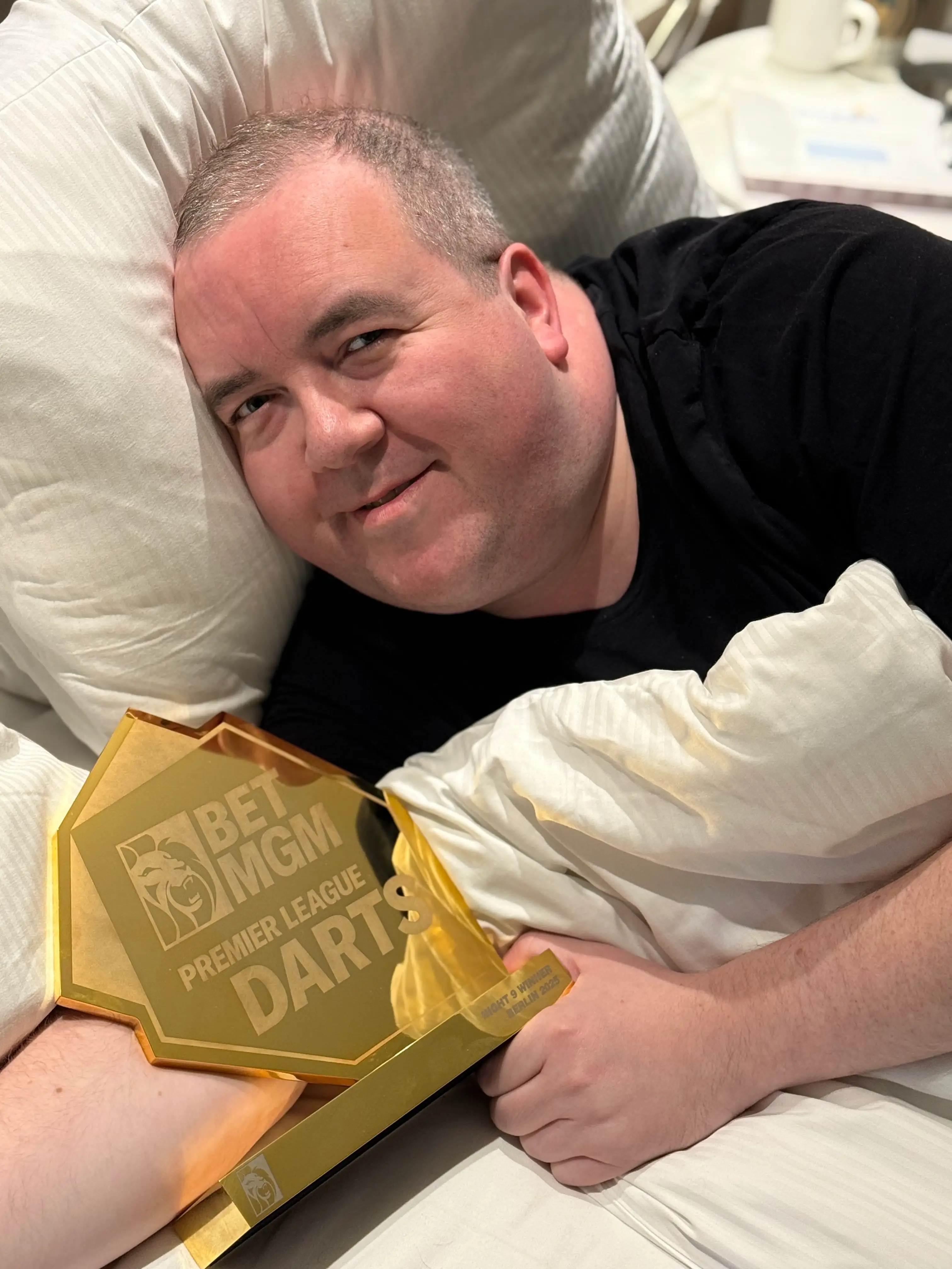 Bunting celebrates with the Bet MGM Premier League trophy. Image credit: Getty