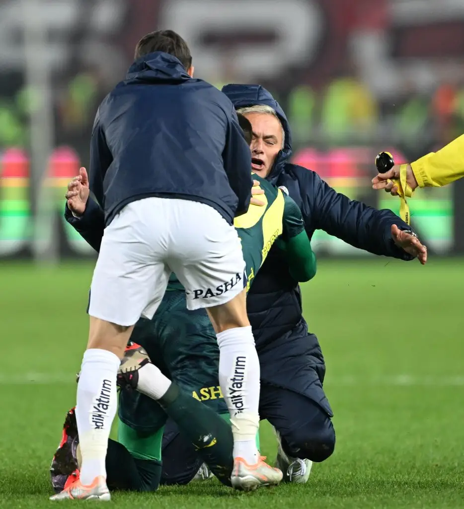 Jose Mourinho celebrates with his players on the pitch during Fenerbahce's 3-2 win over Trabzonspor - Getty