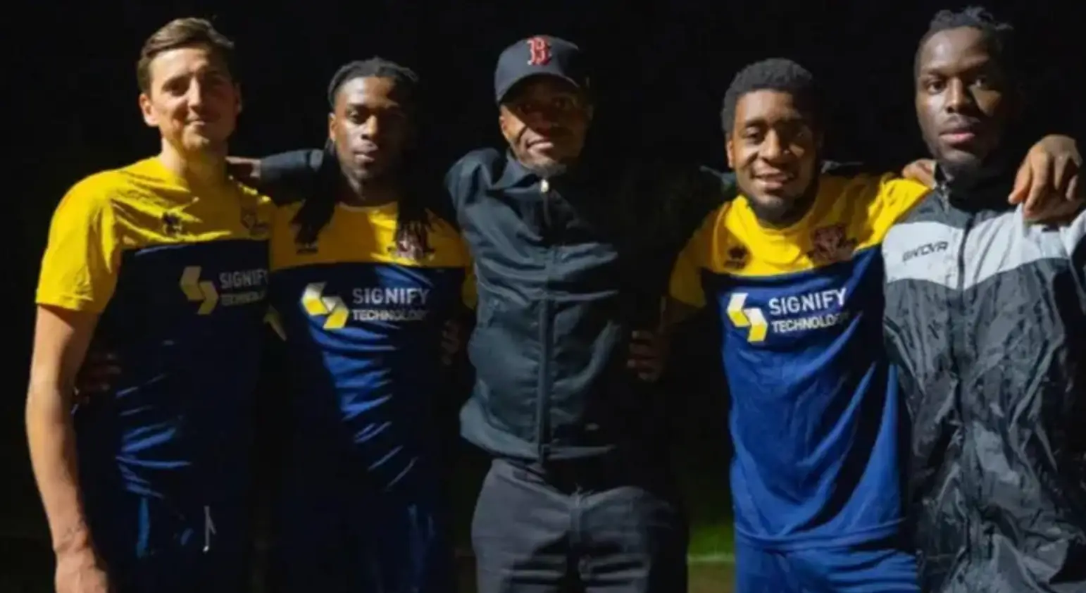Wilfried Zaha pictured with AFC Croydon Athletic players. Image credit: Getty