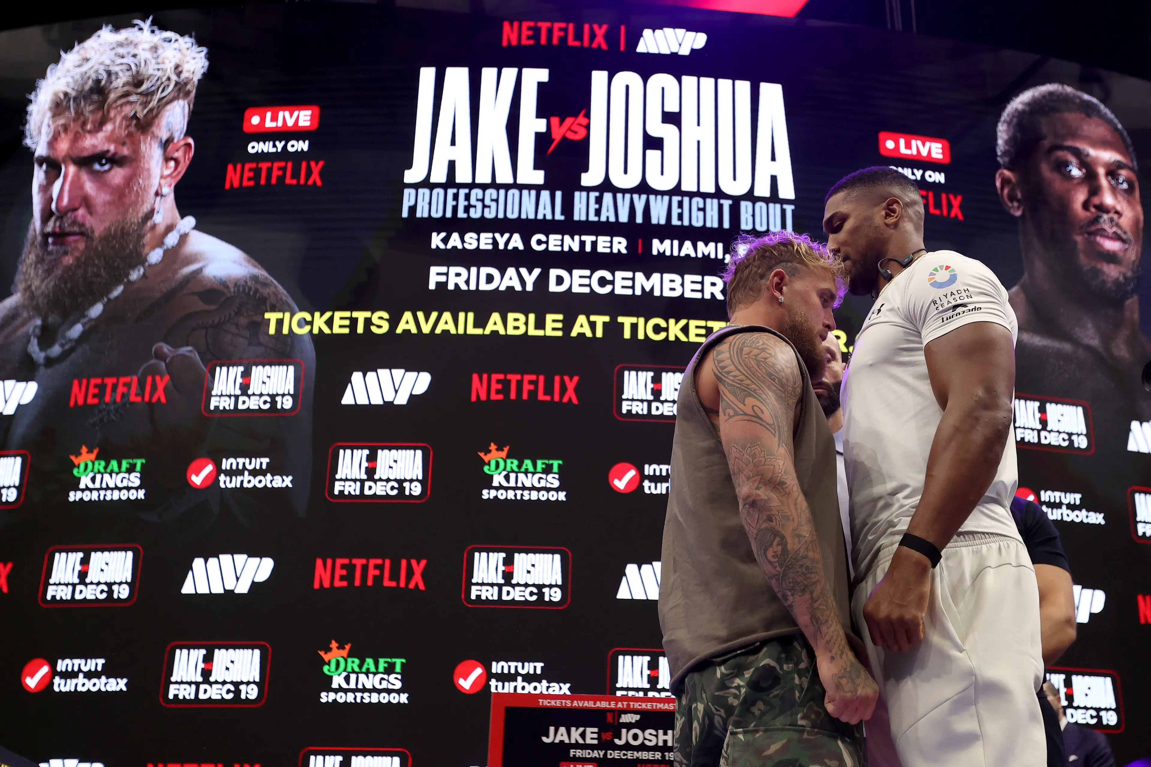 Jake Paul and Anthony Joshua face off at the launch presser. Image: Getty