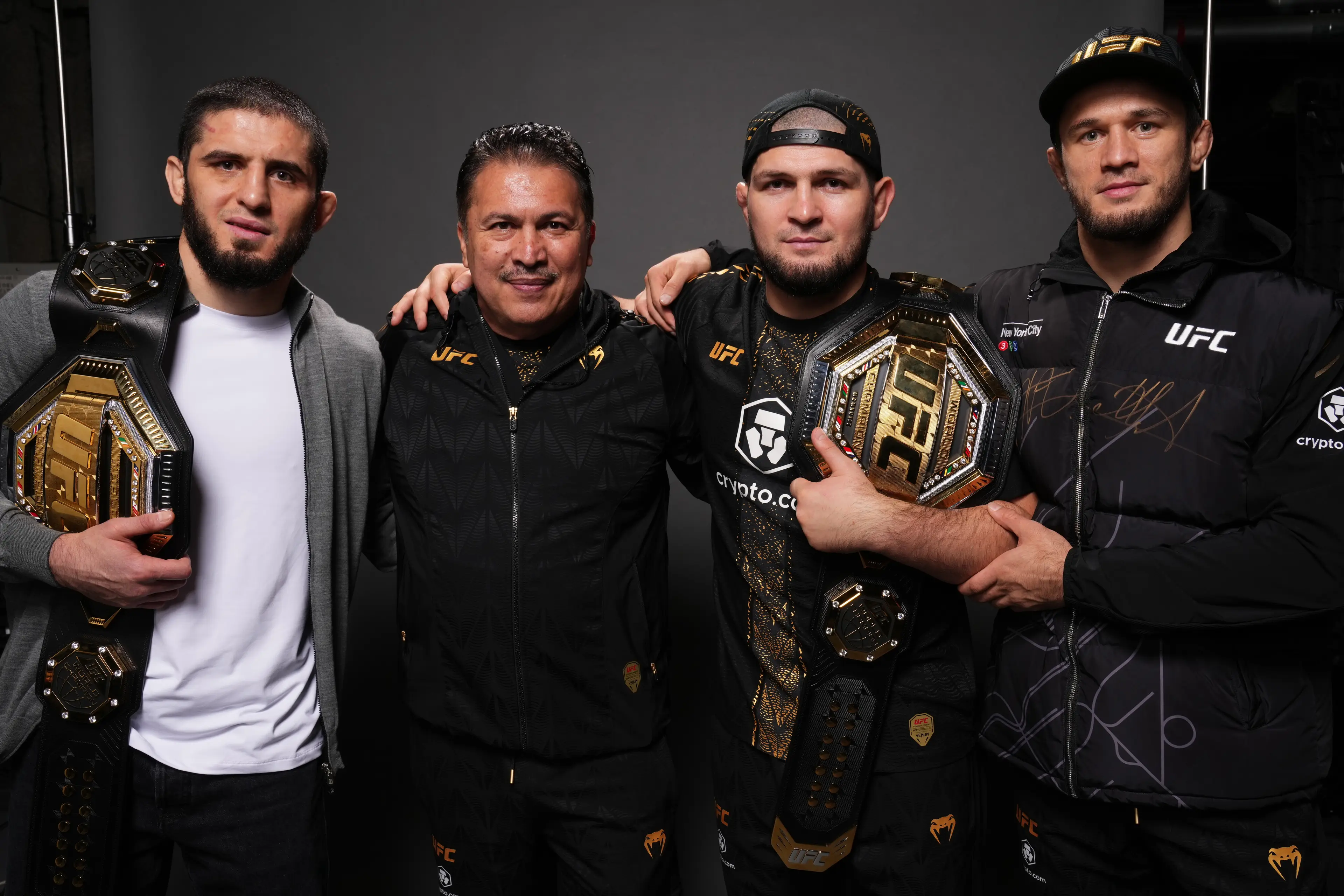Islam Makhachev celebrates his UFC 322 victory with his team. Image: Getty 