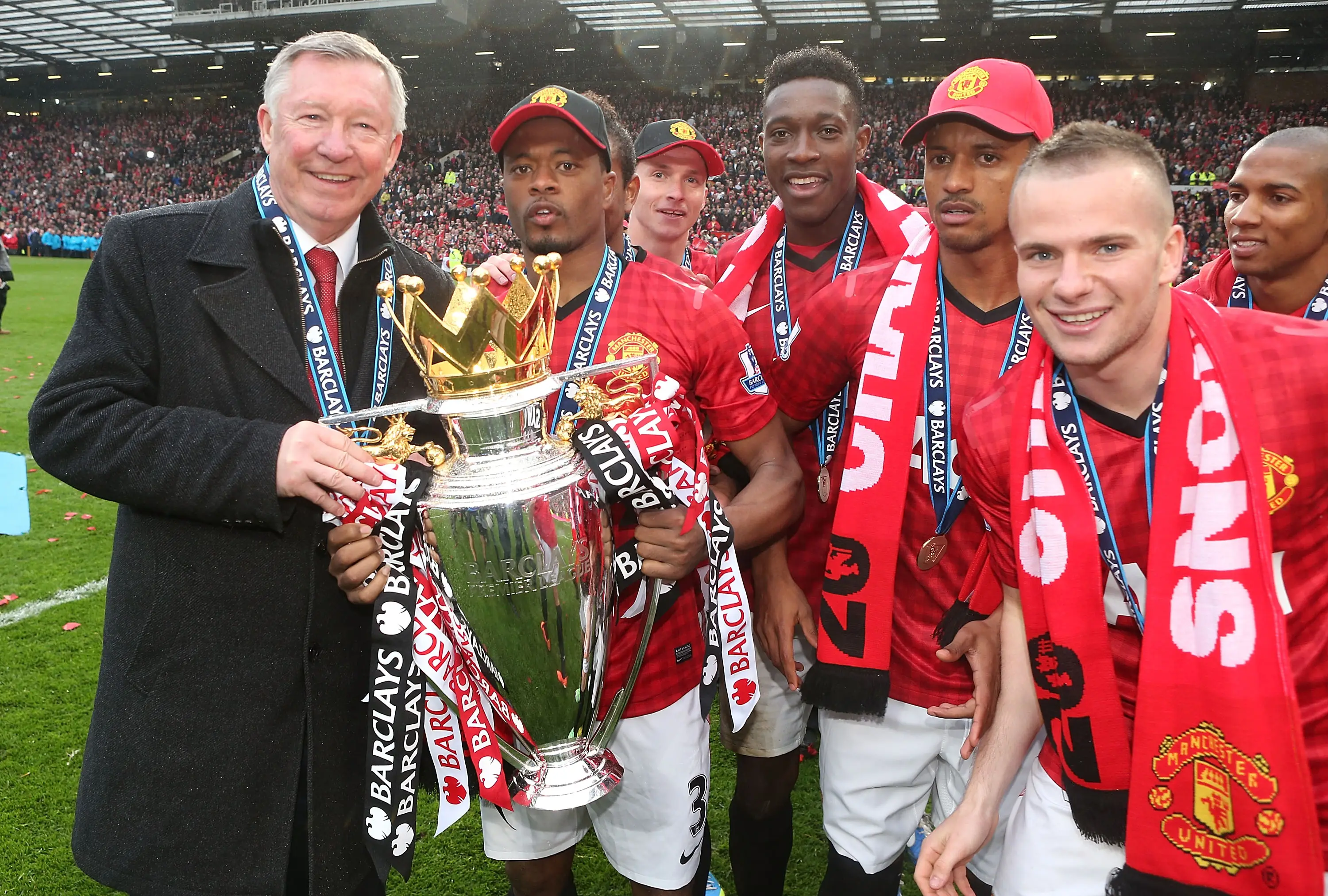 Patrice Evra celebrates winning the Premier League with Sir Alex Ferguson. Image: Getty