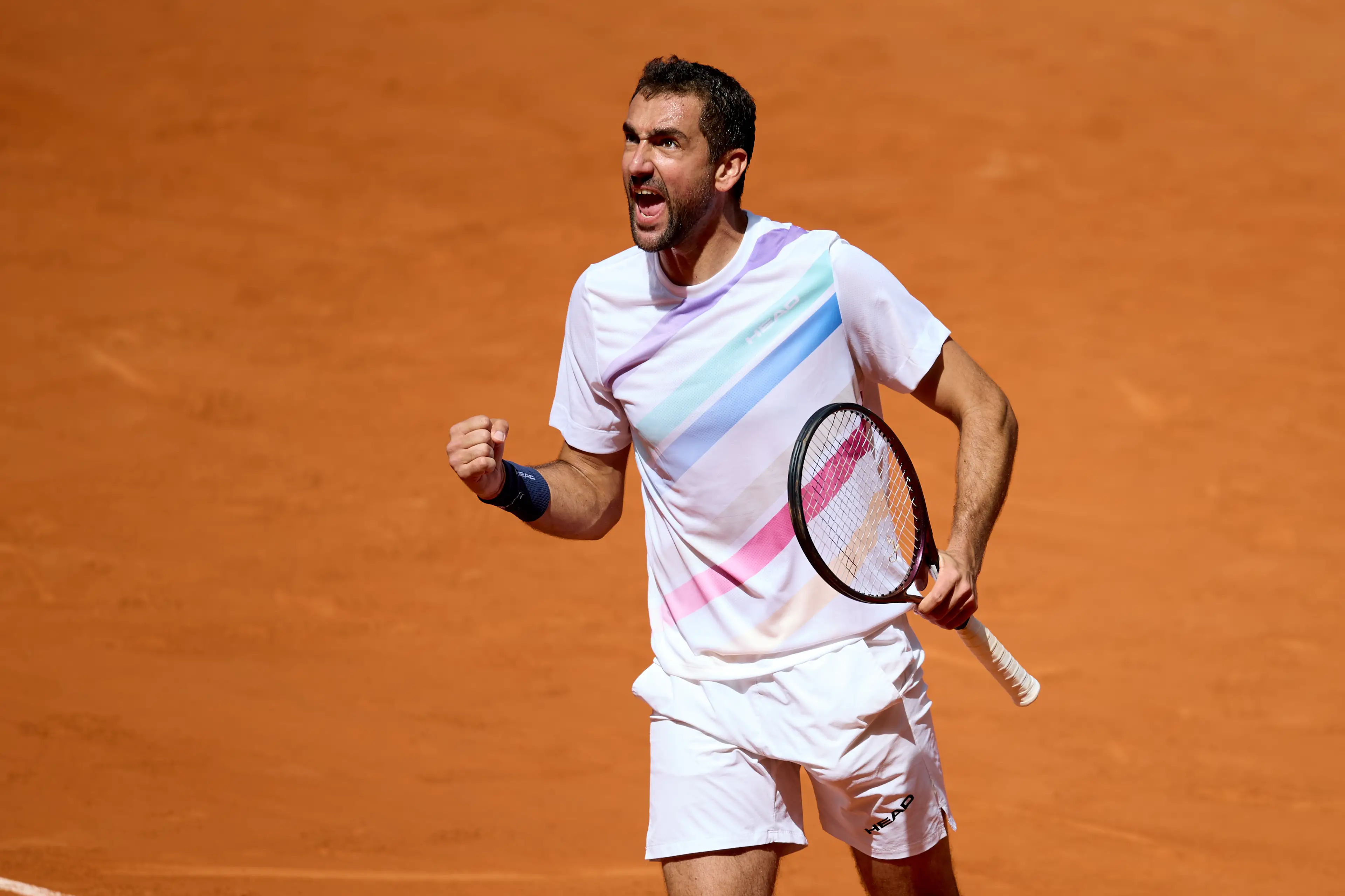 Marin Cilic of Croatia celebrates winning a point against Zizou Bergs of Belgium during the Men’s Singles First Round match at Arantxa Sanchez Stadium (Getty Images)