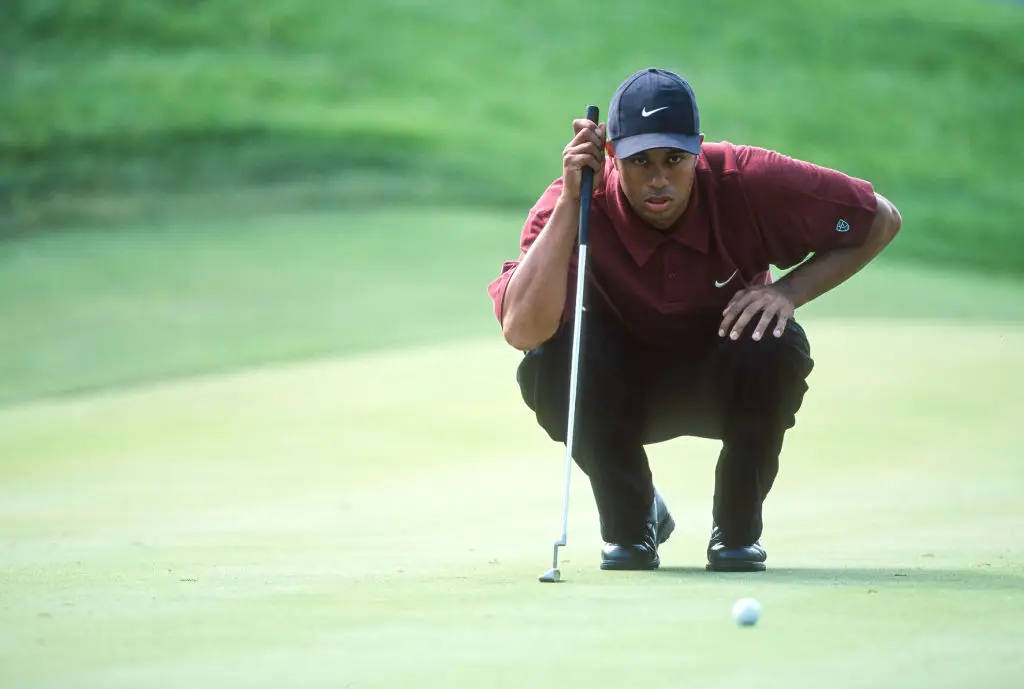 Tiger Woods became known for wearing red polos on the final day of play of each competition. (Image: Simon Bruty/Any Chance/Getty Images)