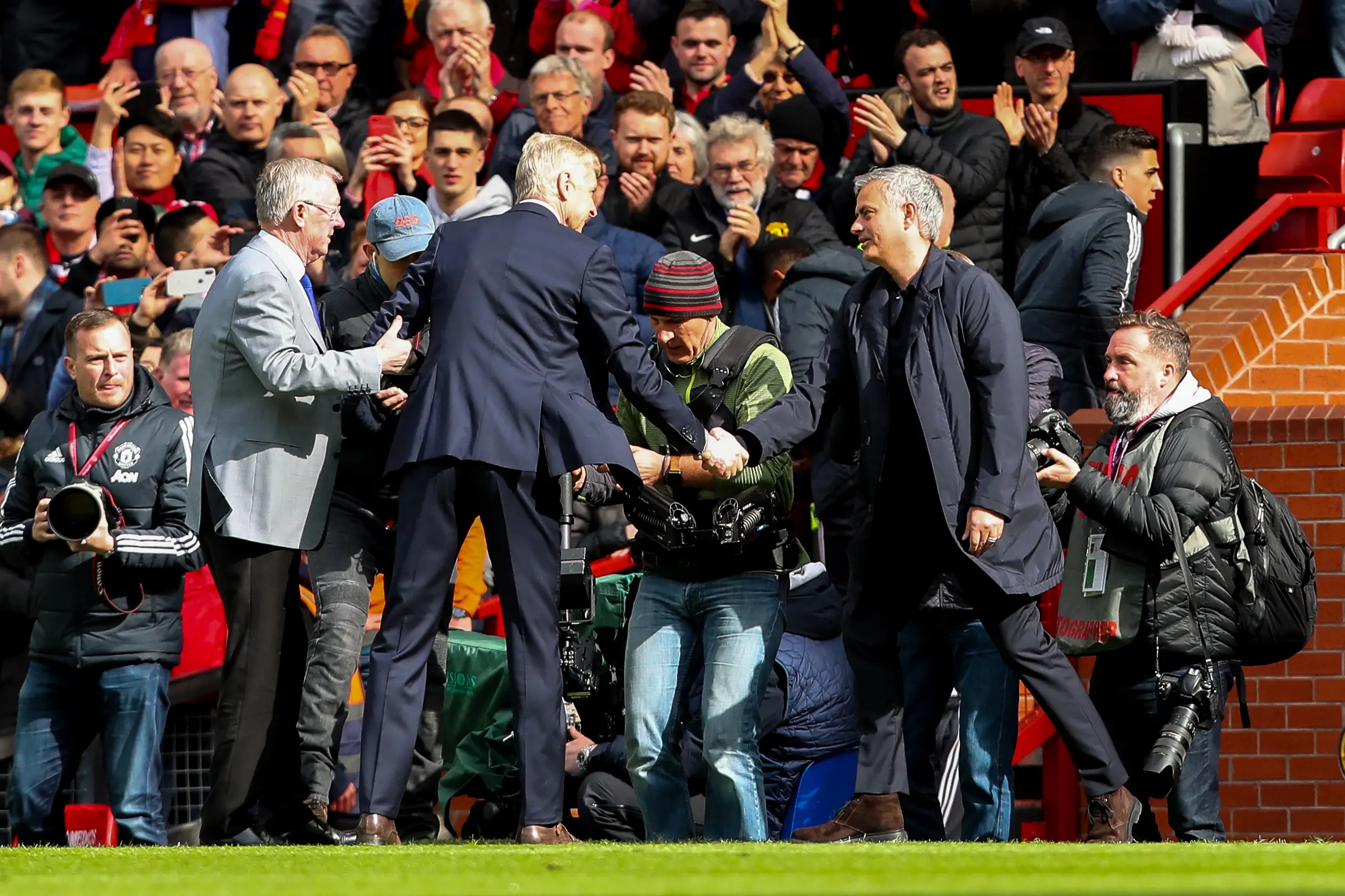 Wenger and Mourinho shake hands in 2018. Image credit: Getty