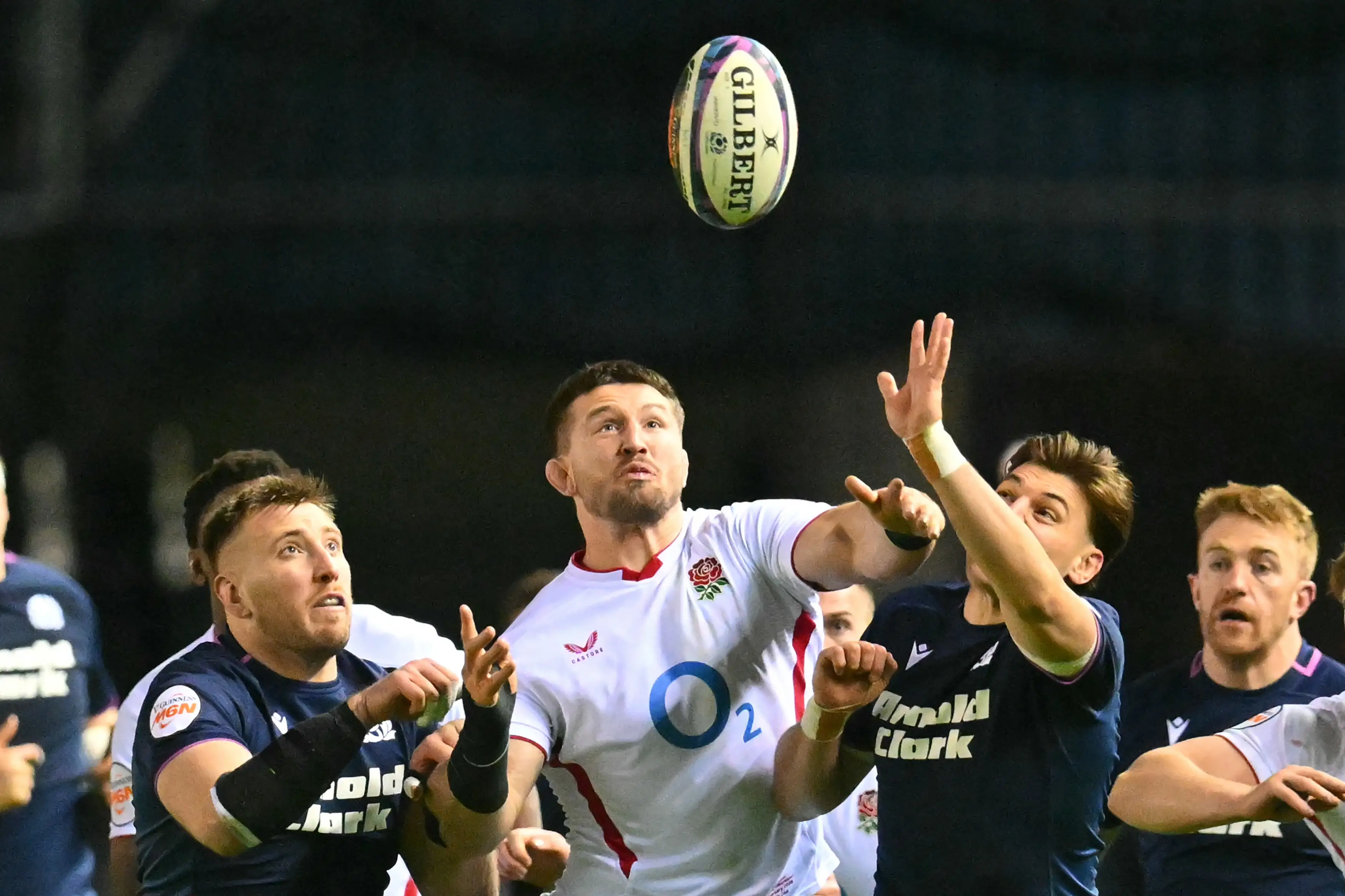 Tom Curry and battling Scottish players for loose ball. (Getty Images)