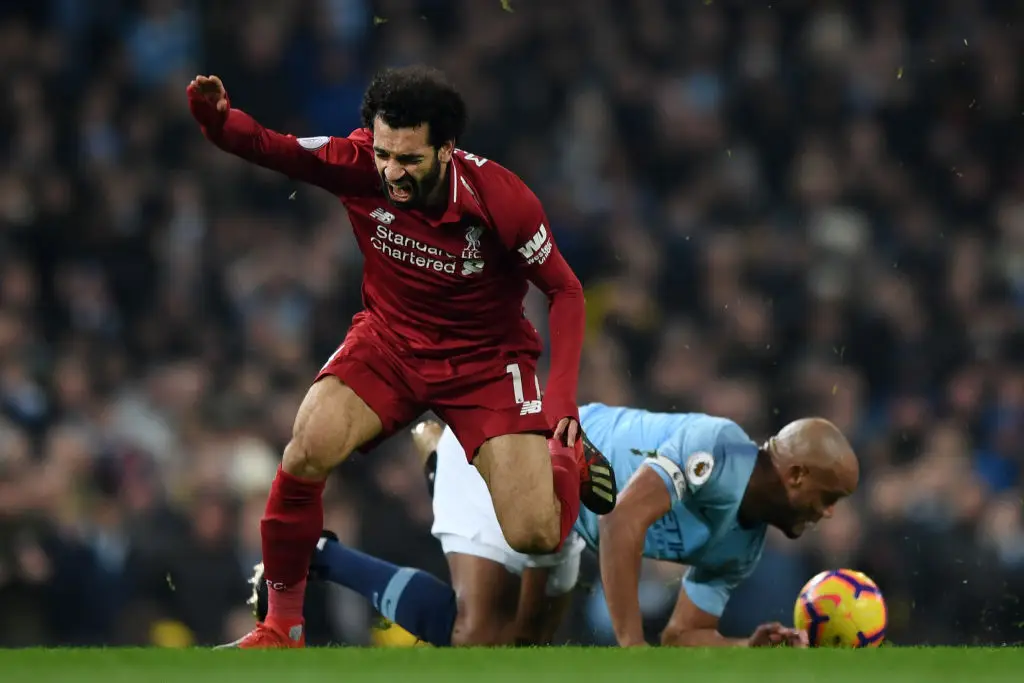 Kompany clash with Salah in 2019 (Image: Getty)