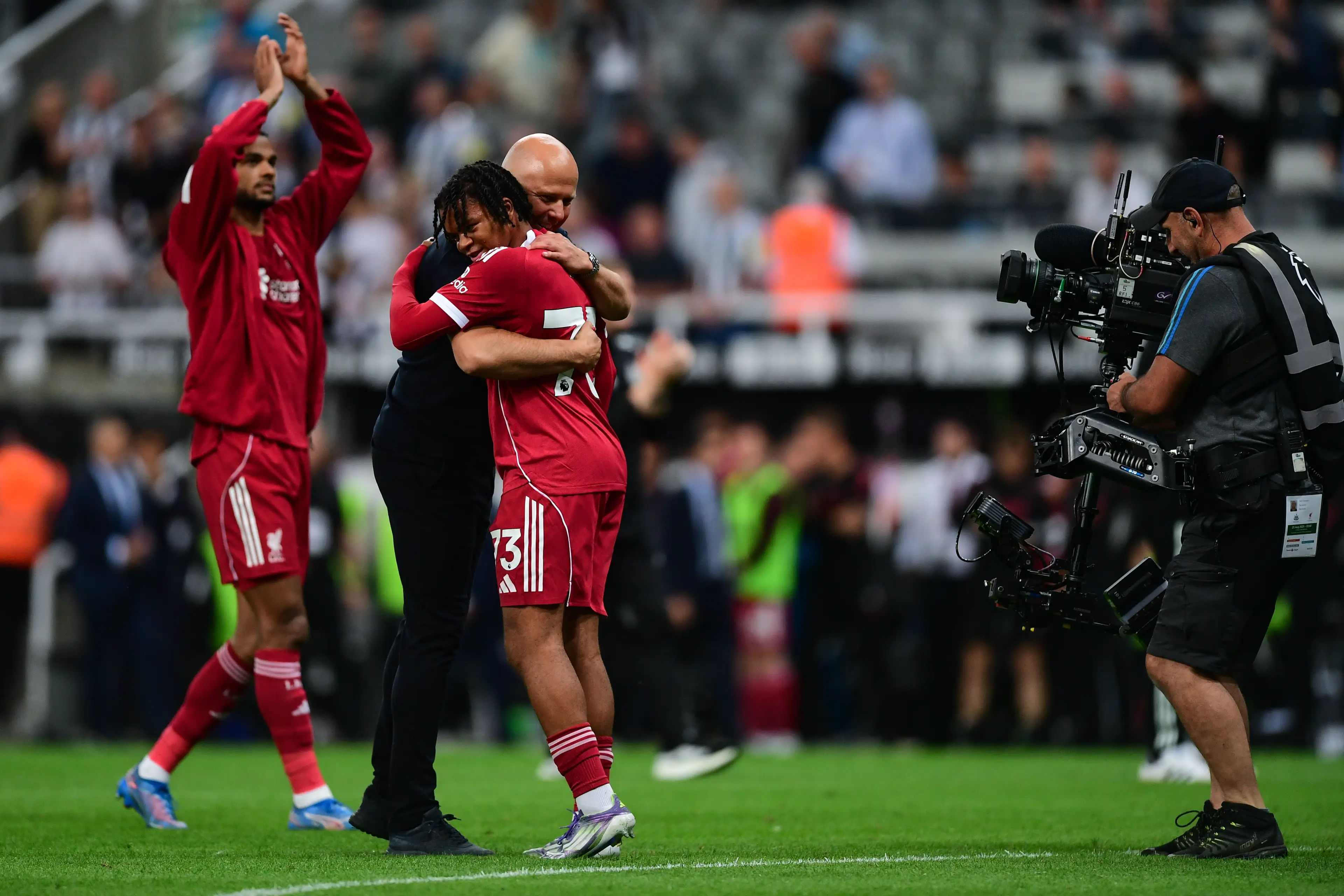 Rio Ngumoha embraced Arne Slot after his dream debut in the Premier League. Image: Getty