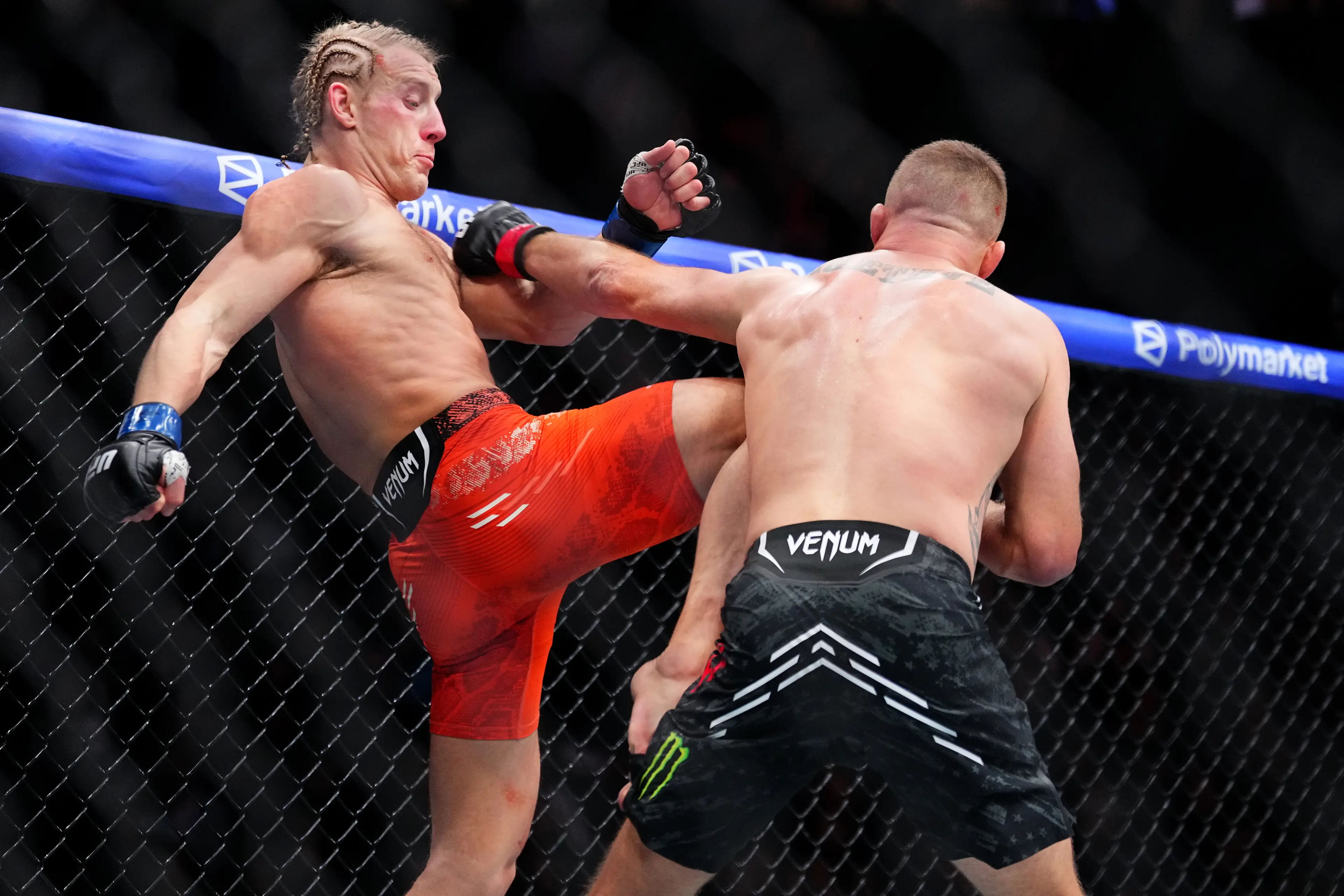 Paddy Pimblett and Justin Gaethje during their UFC 324 title fight. Image: Getty 