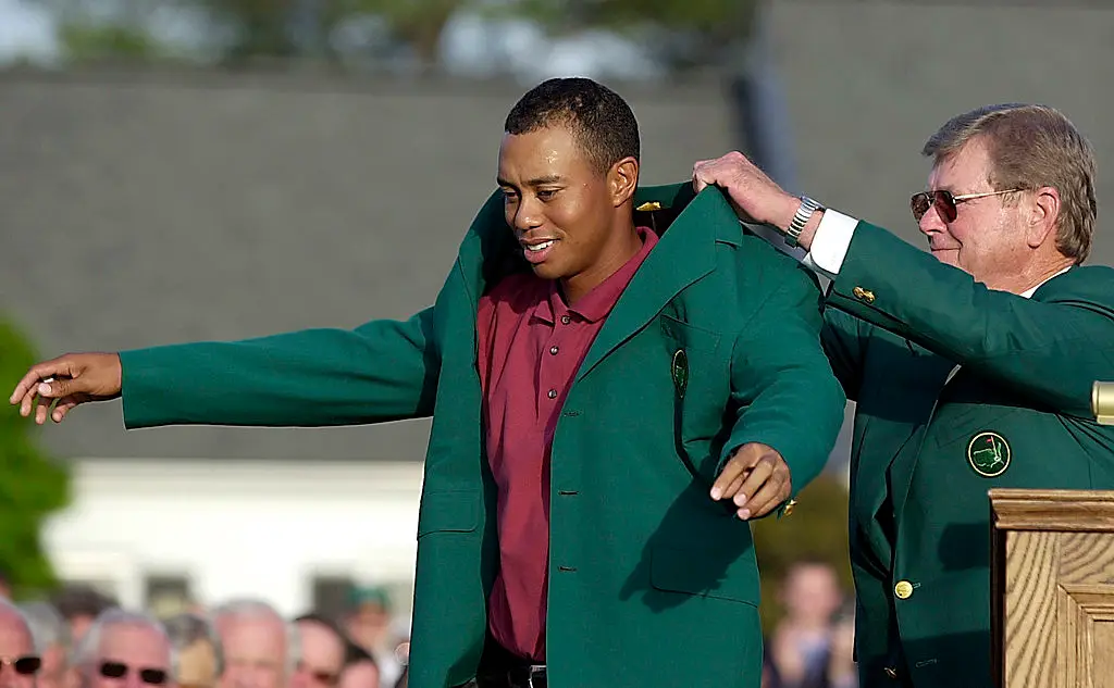 Augusta National chairman Hootie Johnson put the green jacket over Woods in 2002. (Image: ROBERTO SCHMIDT/AFP via Getty Images)