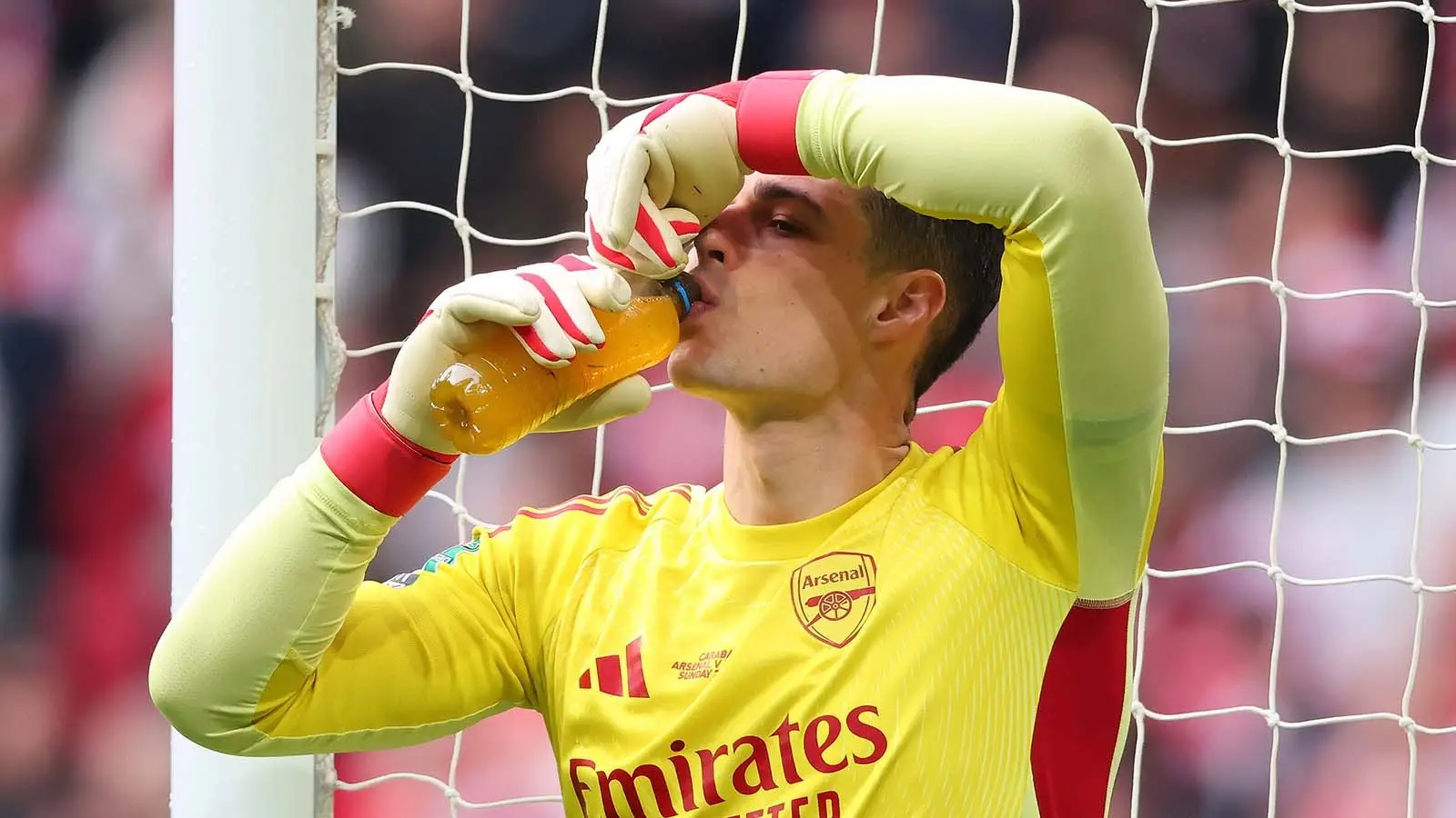 Kepa drinks from his water bottle during Arsenal's Carabao Cup defeat to Manchester City