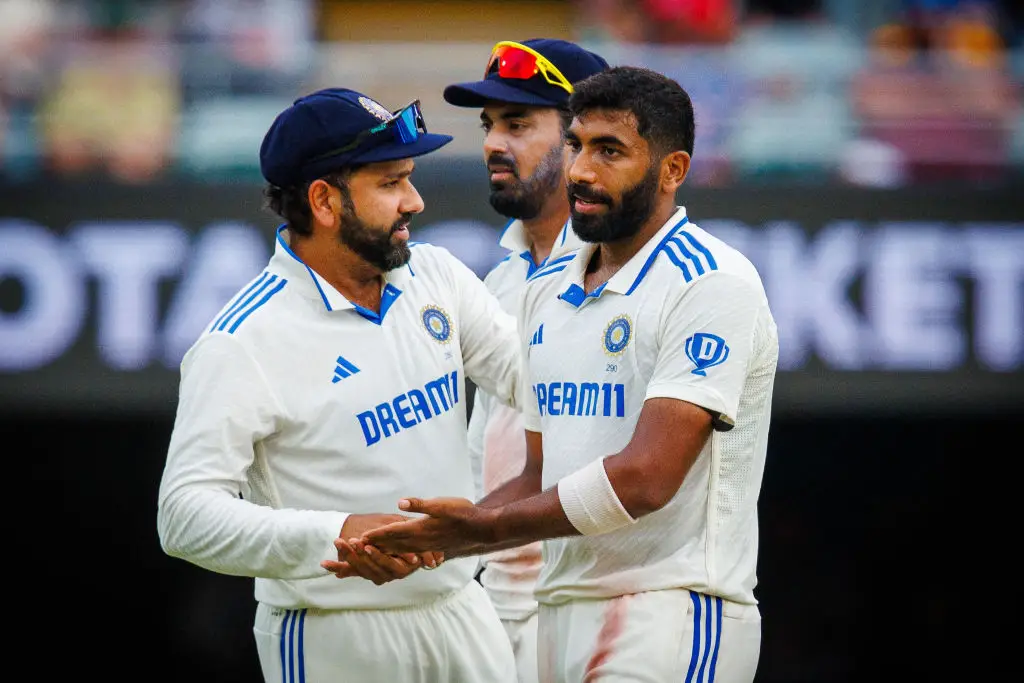 Jasprit Bumrah celebrates with India captain Rohit Sharma after dismissing Australia's Travis Head in Brisbane (Image: Getty)