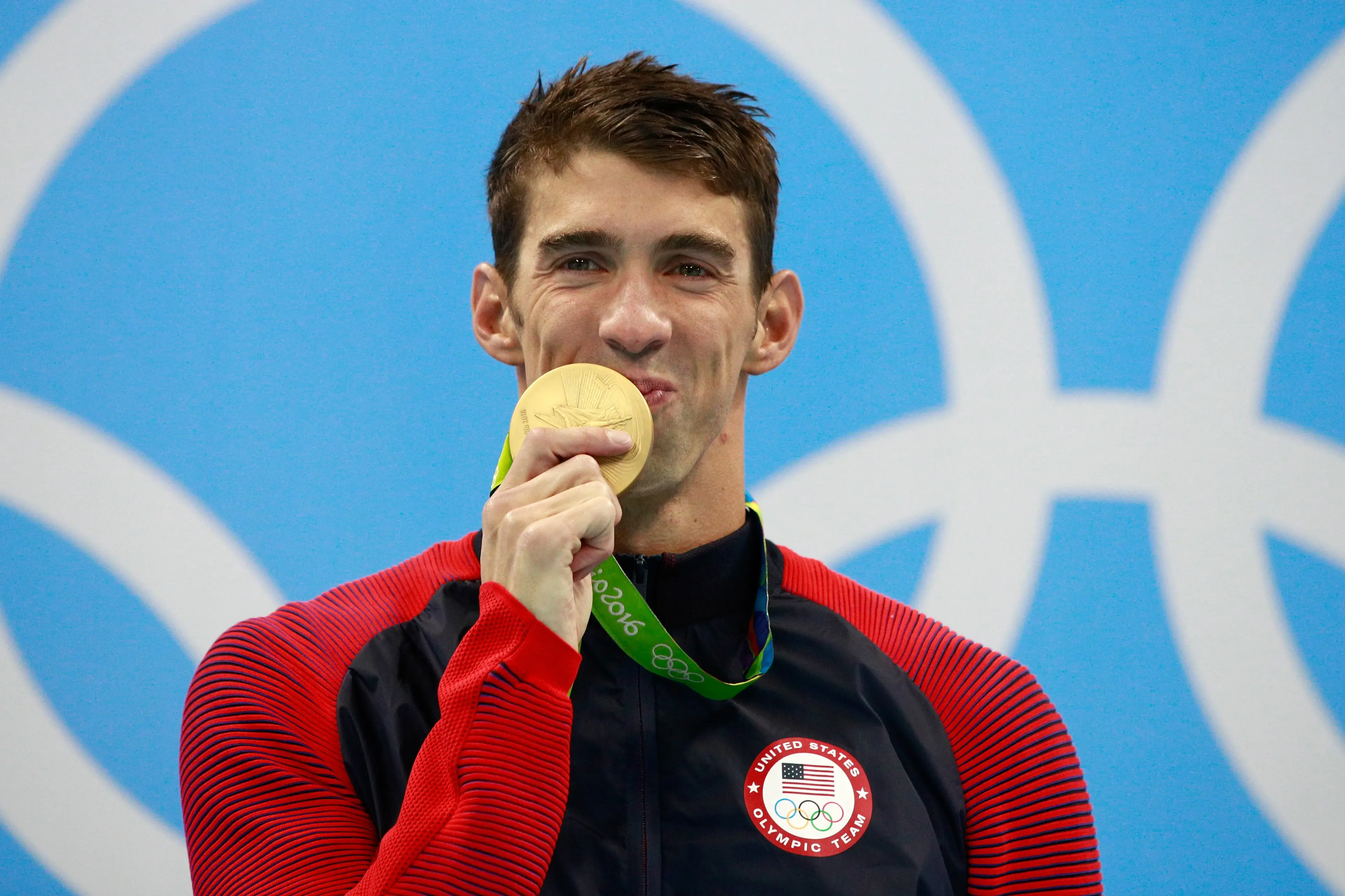 Michael Phelps celebrates winning an Olympic gold medal. Image: Getty 