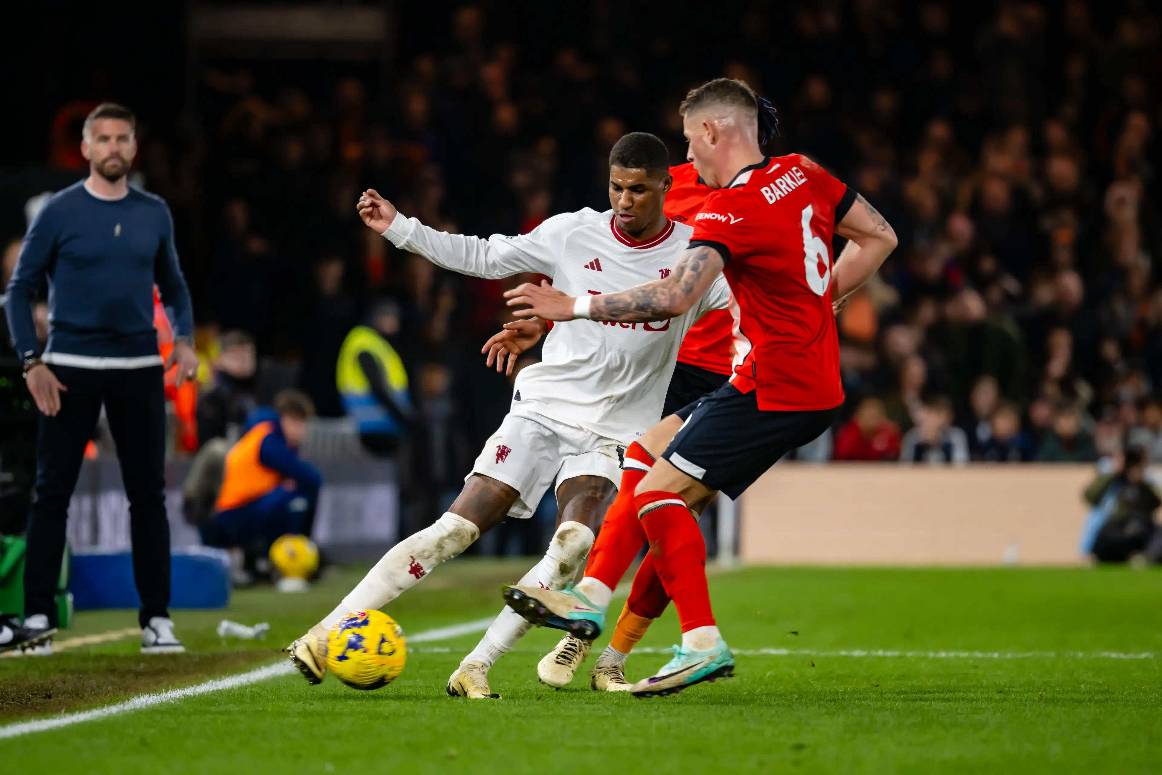 Rashford attempting to dribble past Reece Burke in the game. (Image