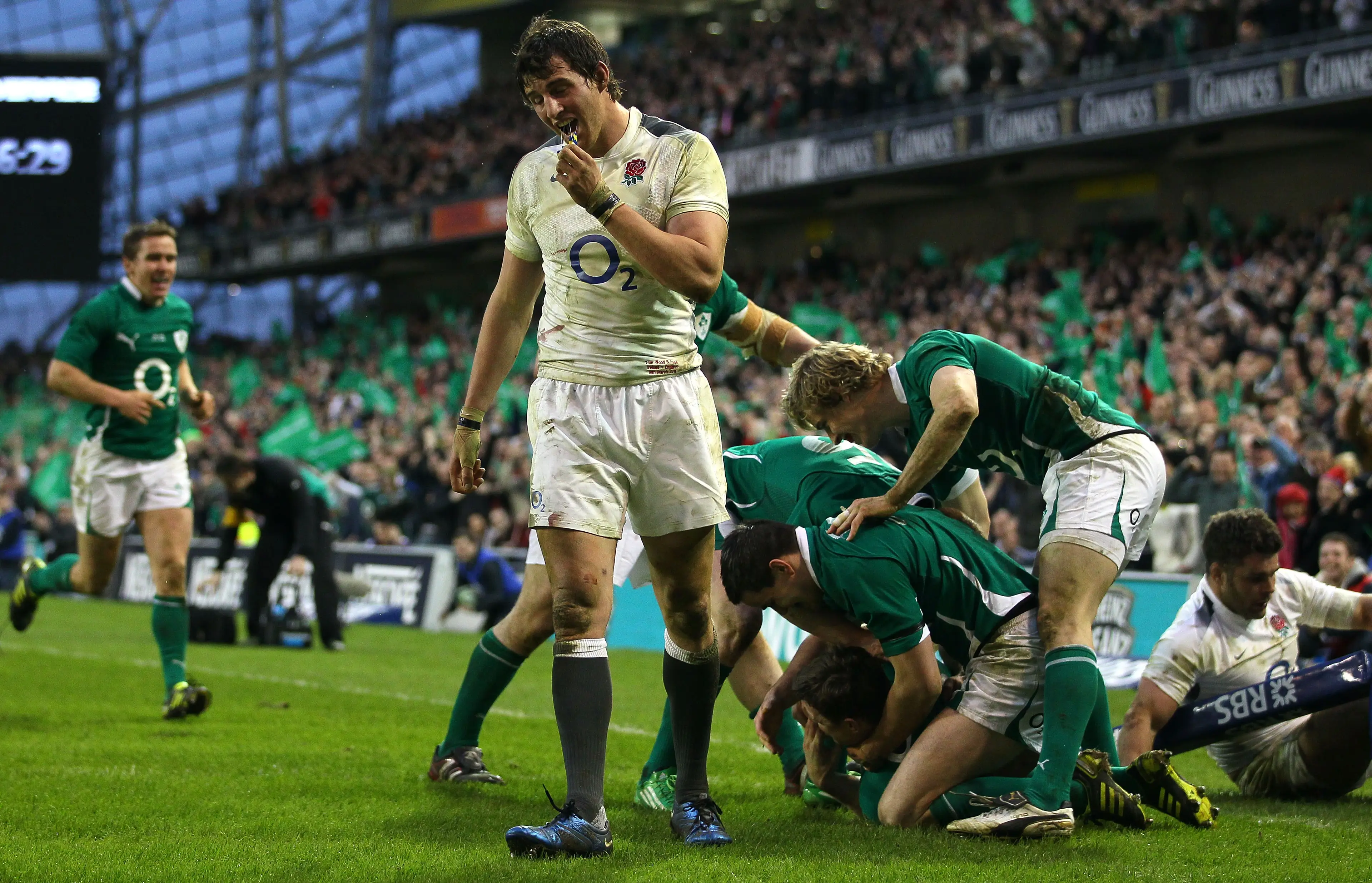 England forwards Tom Wood (l) and Nick Easter (r) look on dejectedly as Ireland centre Brian O'Driscoll and team mates celebrate his try during the RBS 6 Nations match between Ireland and England (Getty Images)