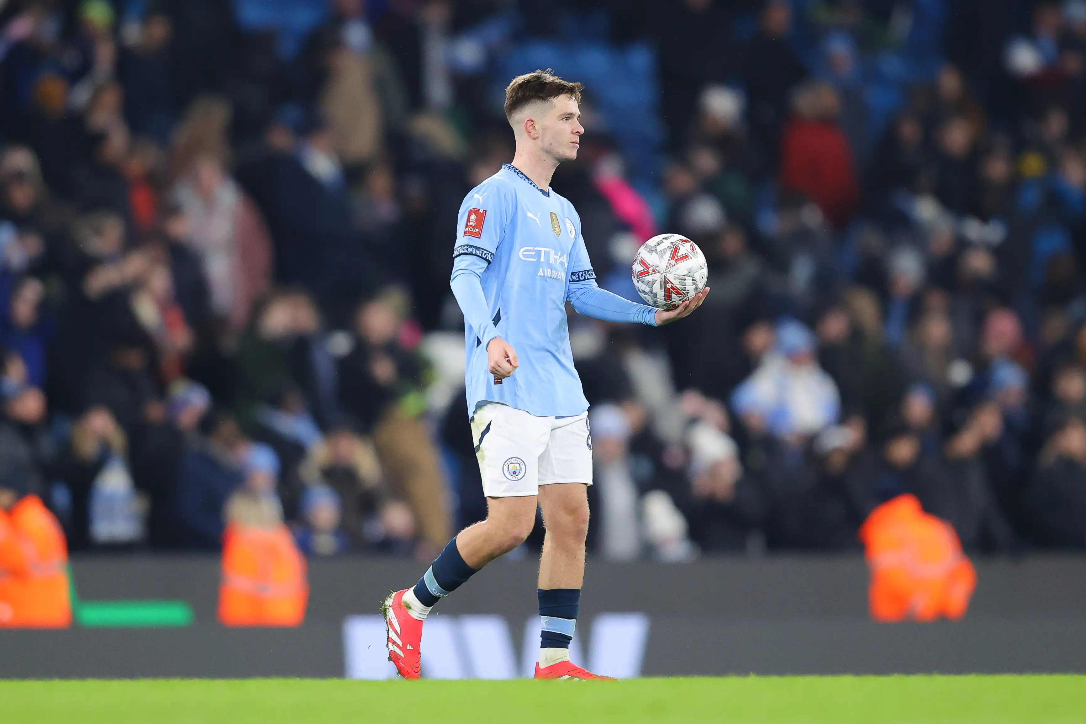 James McAtee takes home the match ball after his hat-trick against Salford City. Image: Getty 