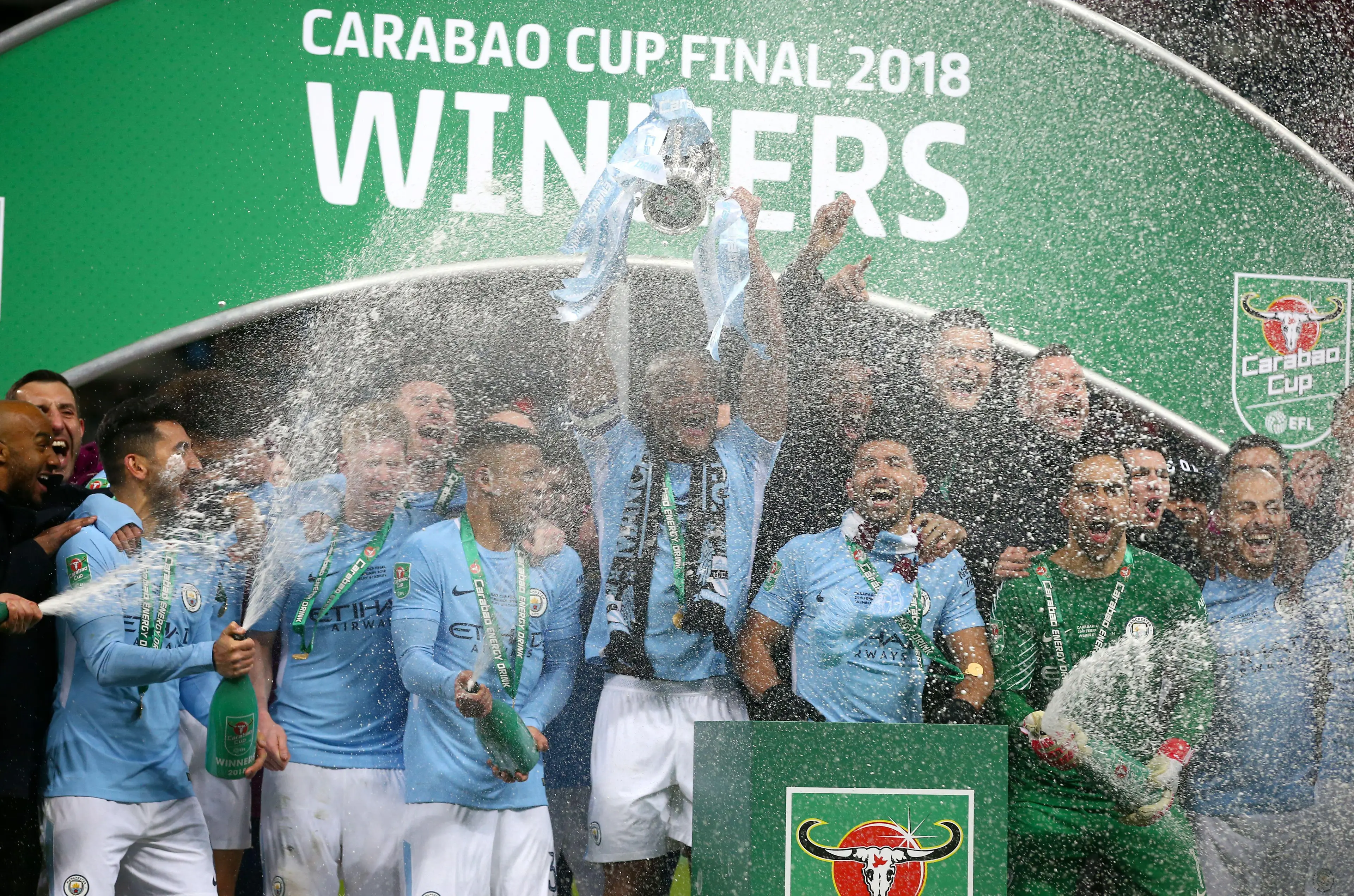 Manchester City players celebrate with the trophy after winning the Carabao Cup Final (Image: PA Images/Alamy)