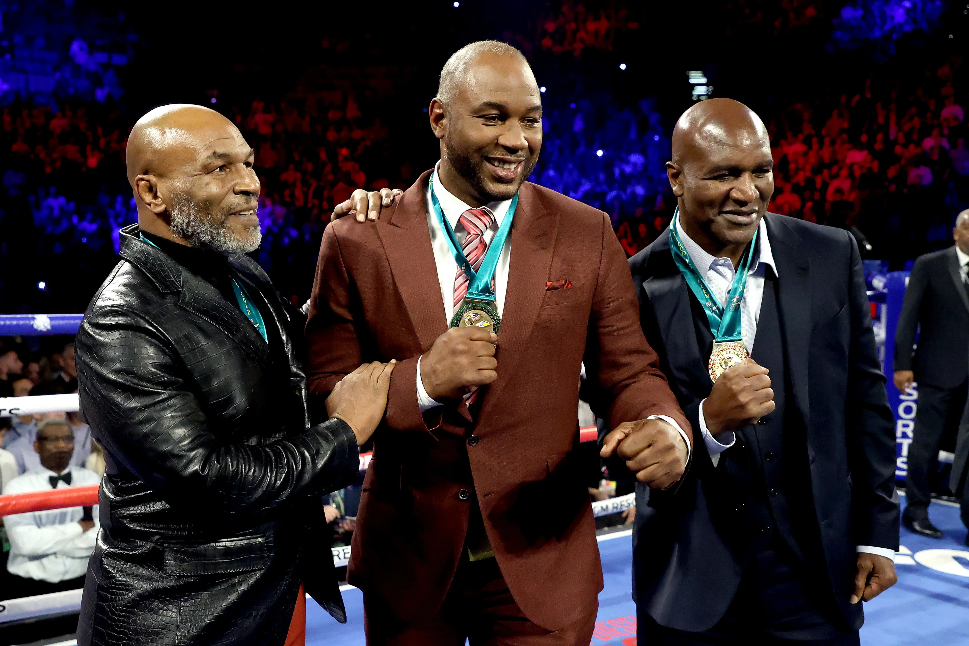 Mike Tyson, Lennox Lewis and Evander Holyfield. (Image: Getty)