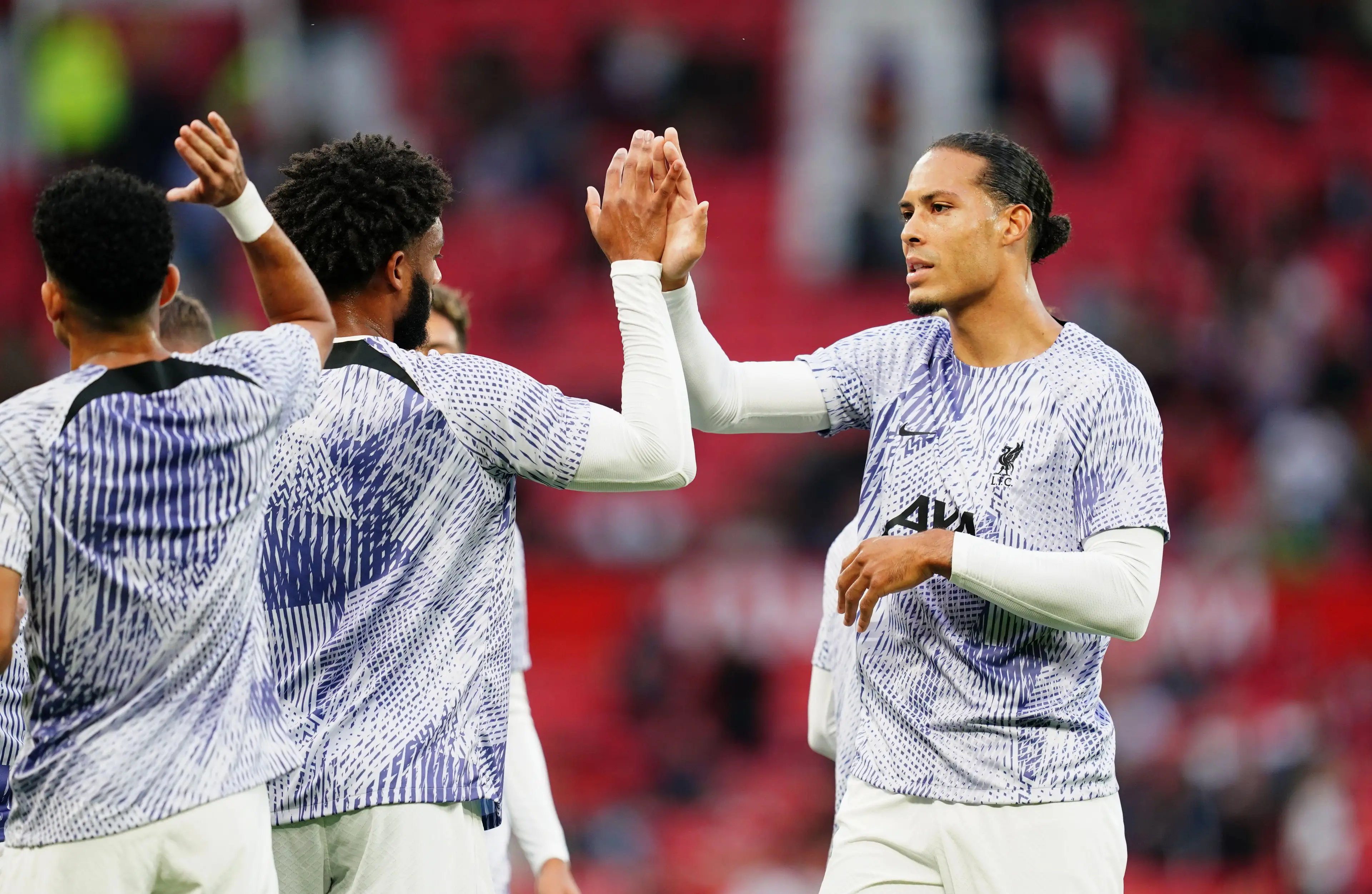 Virgil van Dijk and Joe Gomez embrace. (Image