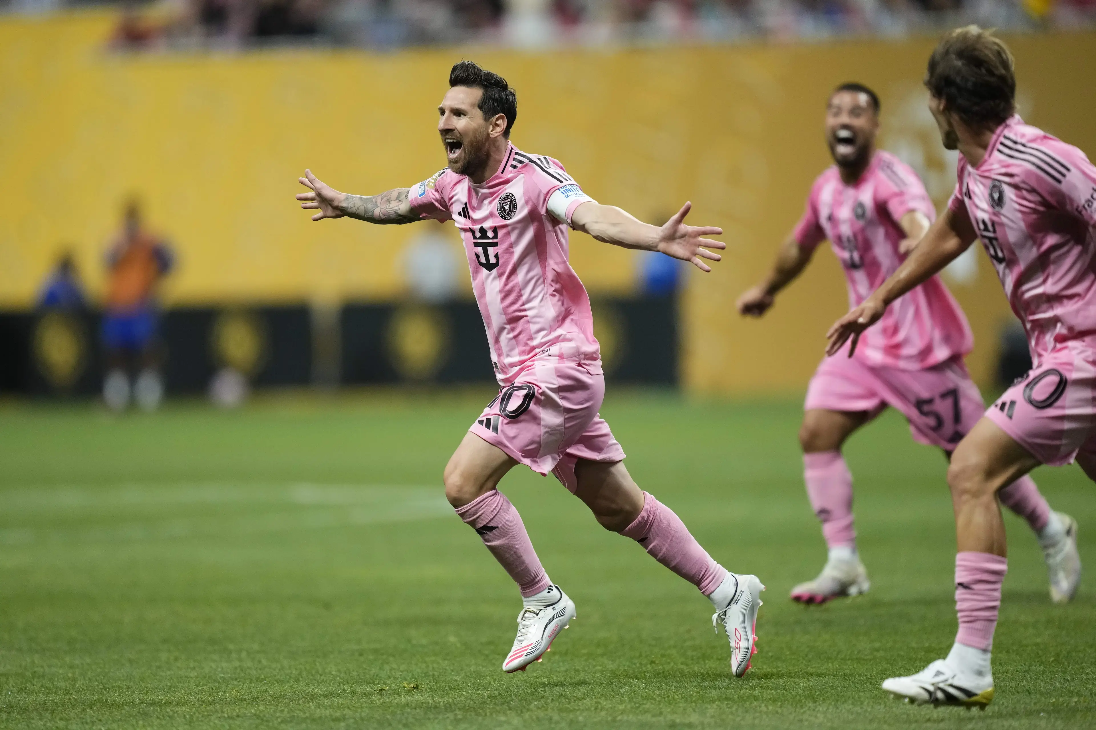 Lionel Messi wheels away in celebration after scoring against Porto. Image: Getty 