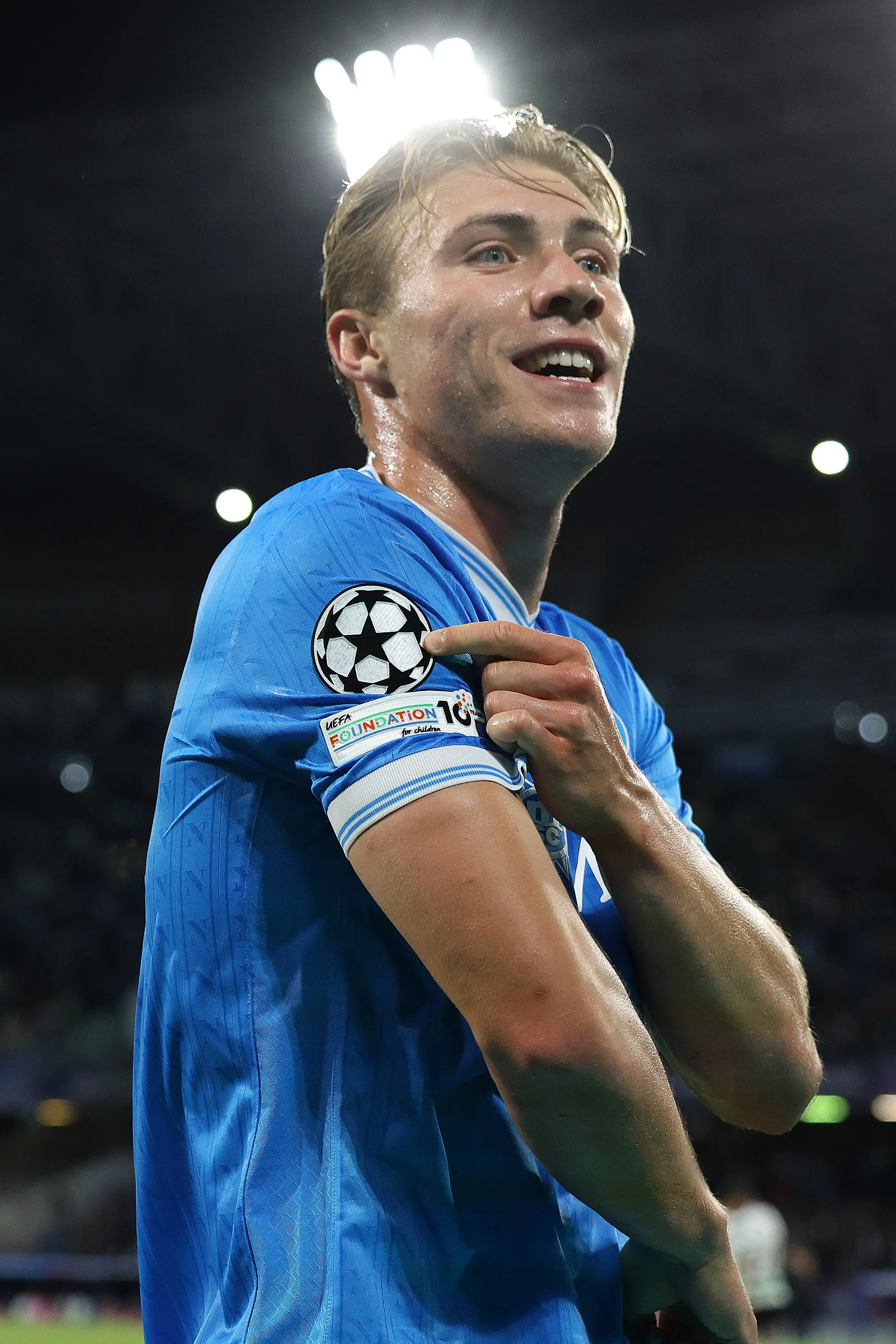 The Danish striker also pointed towards the Champions League logo. Image credit: Getty
