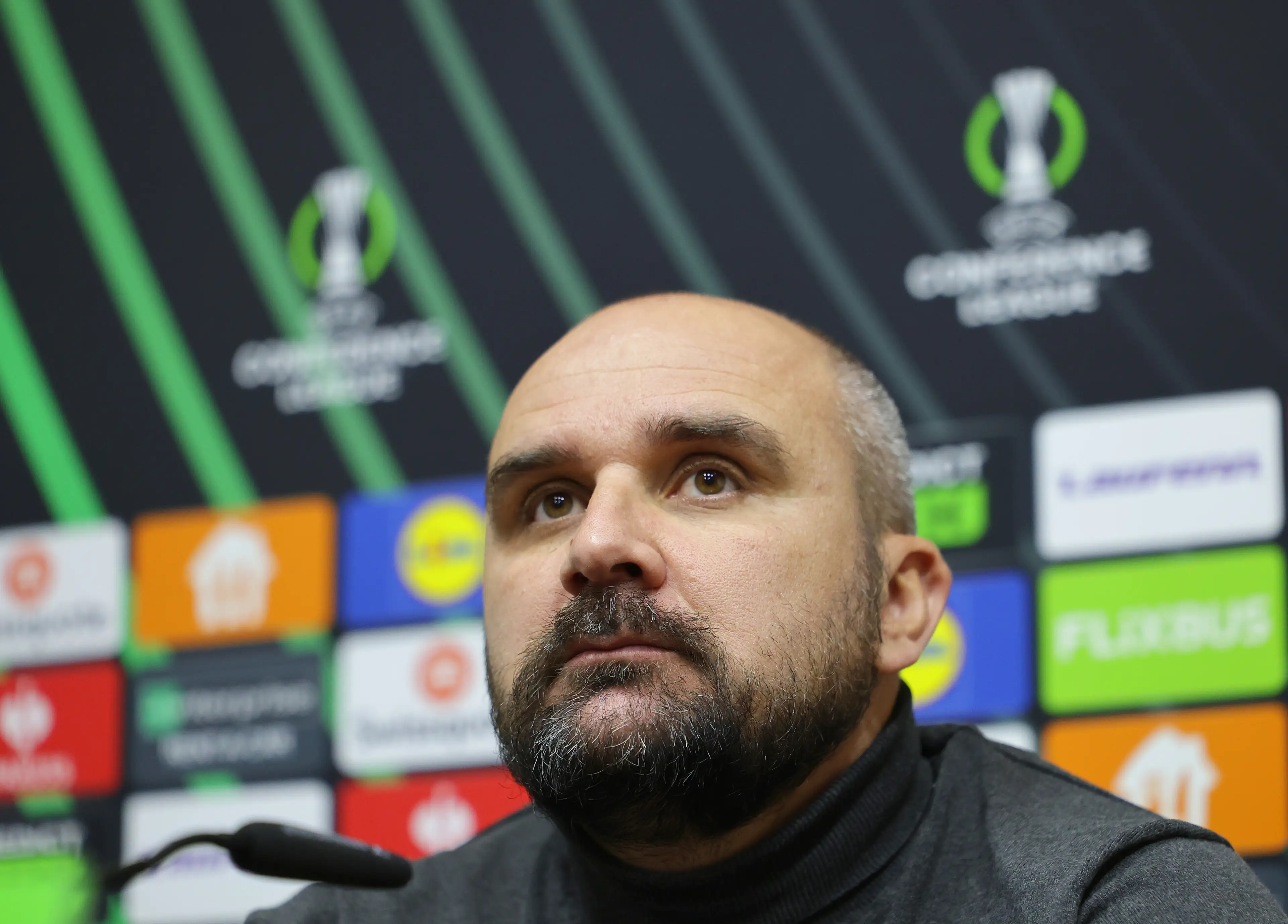 Mladen Zizovic pictured in March 2025 during a post-match press conference after the Conference League clash between FK Borac and SK Rapid. Image credit: Getty