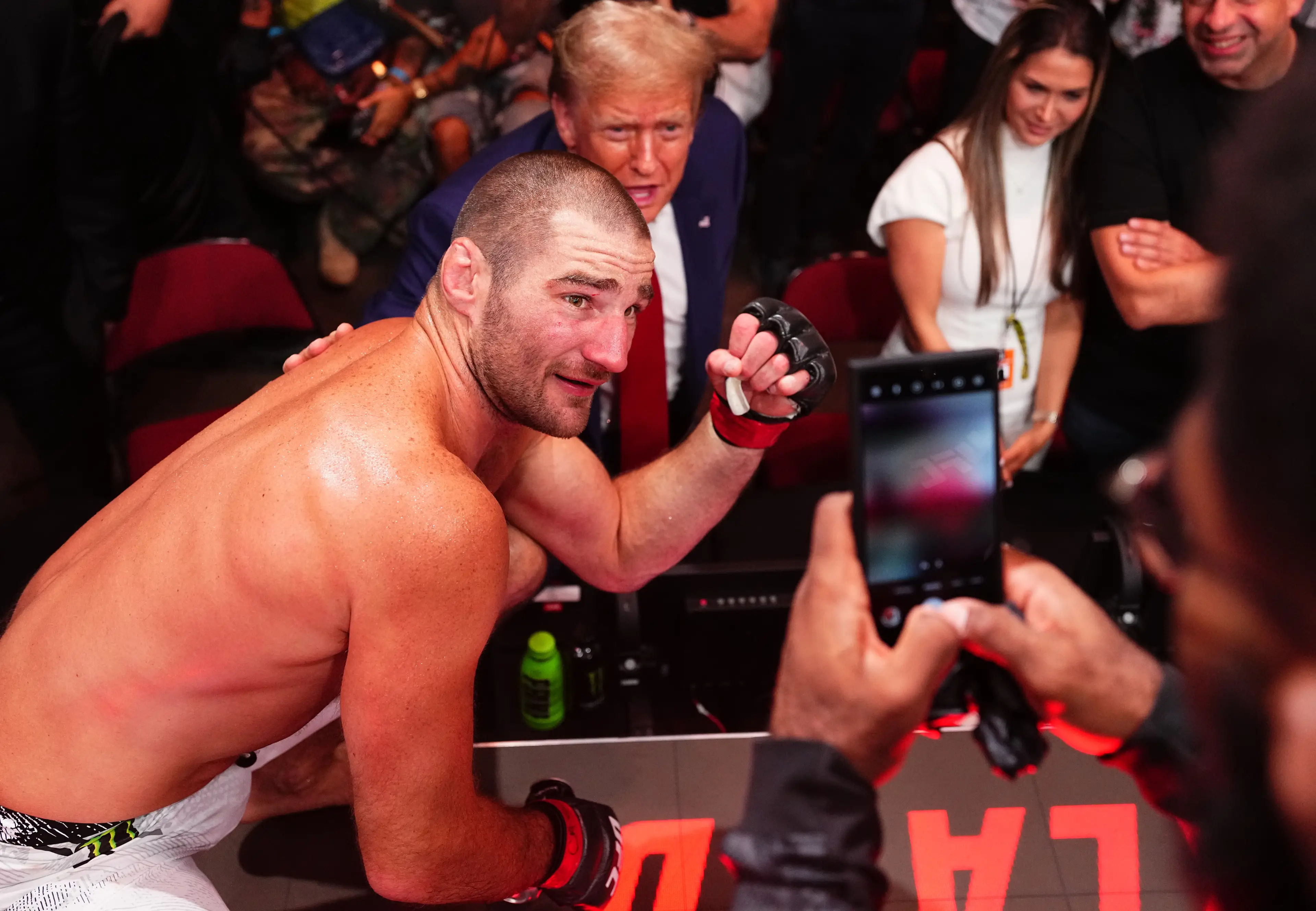 Sean Strickland poses for a photo with Donald Trump at UFC 302. Image: Getty 