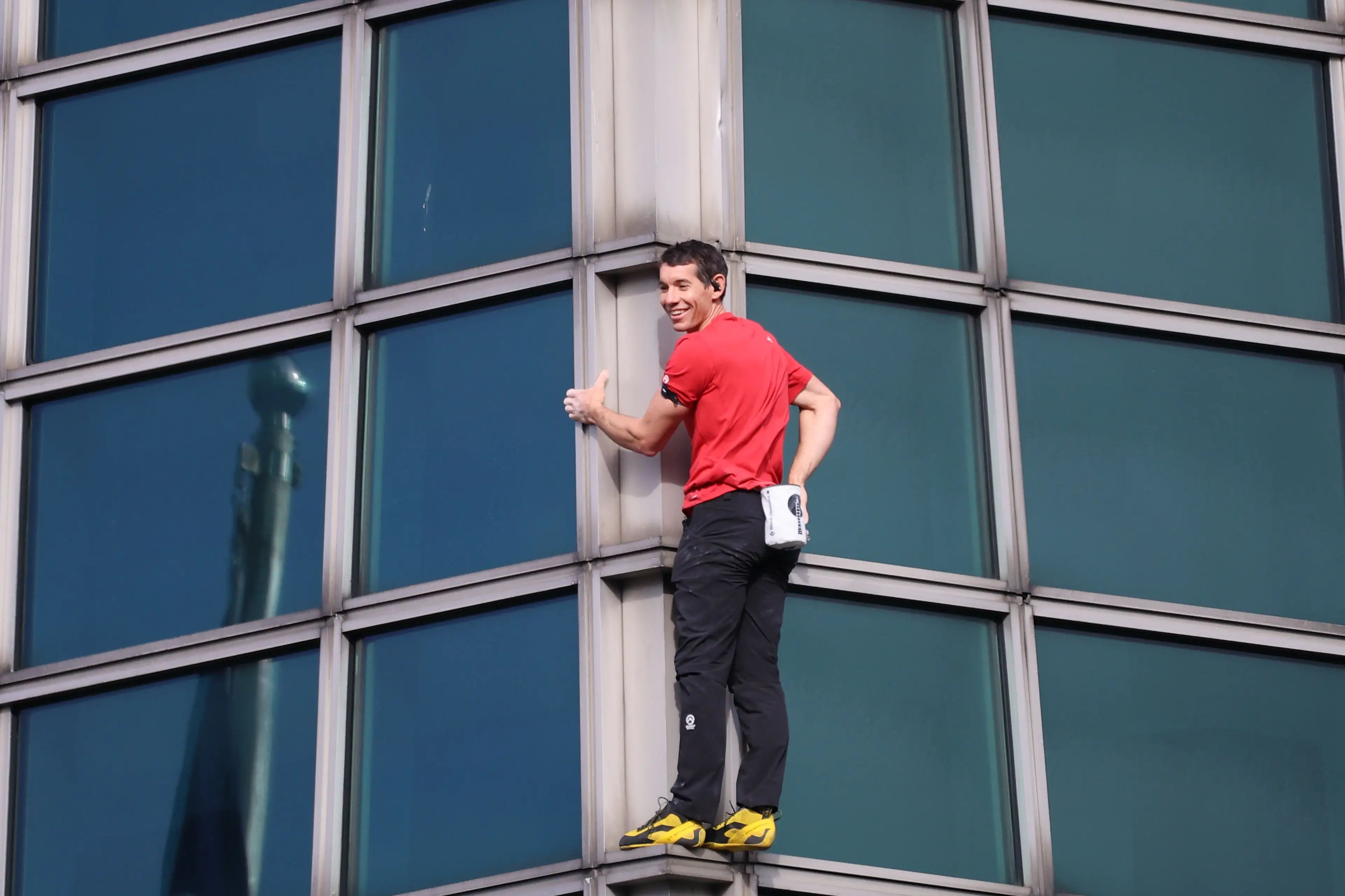 Alex Honnold climbs Taipei 101 building by hand in Taipei. Image credit: Getty