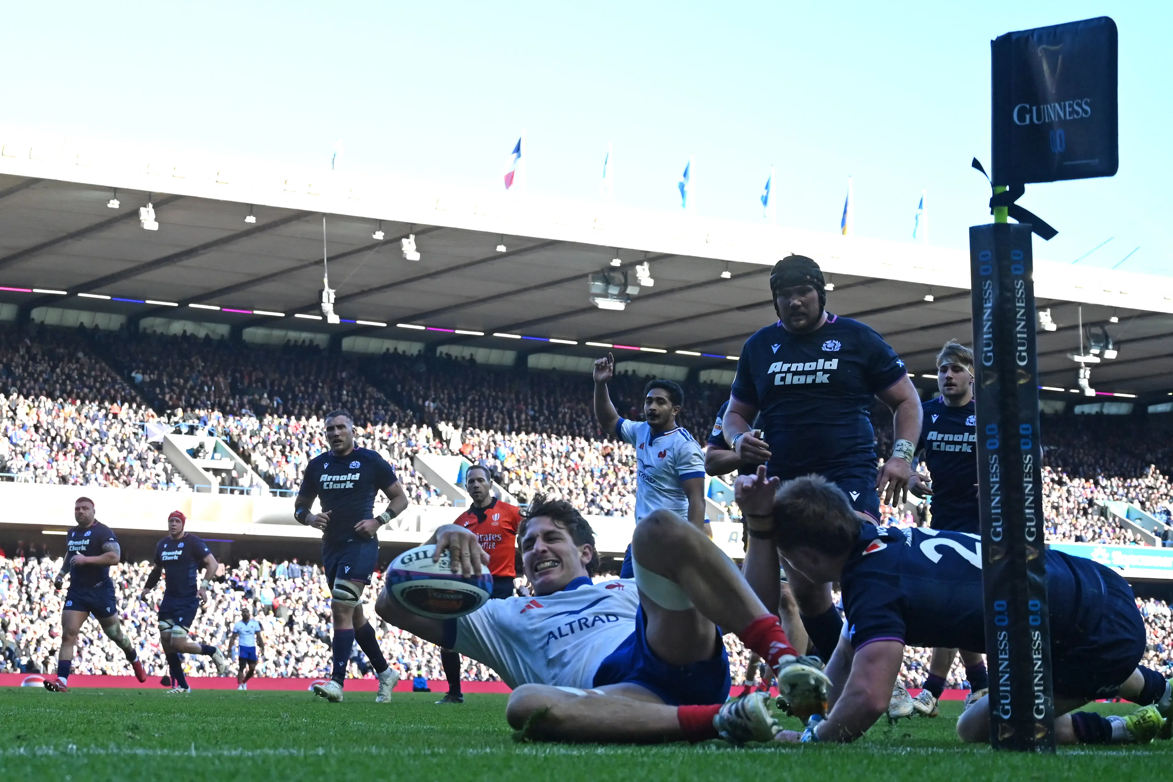 France's flanker Oscar Jegou scores in the corner during the Six Nations international rugby union match between Scotland and France  (Getty Images)