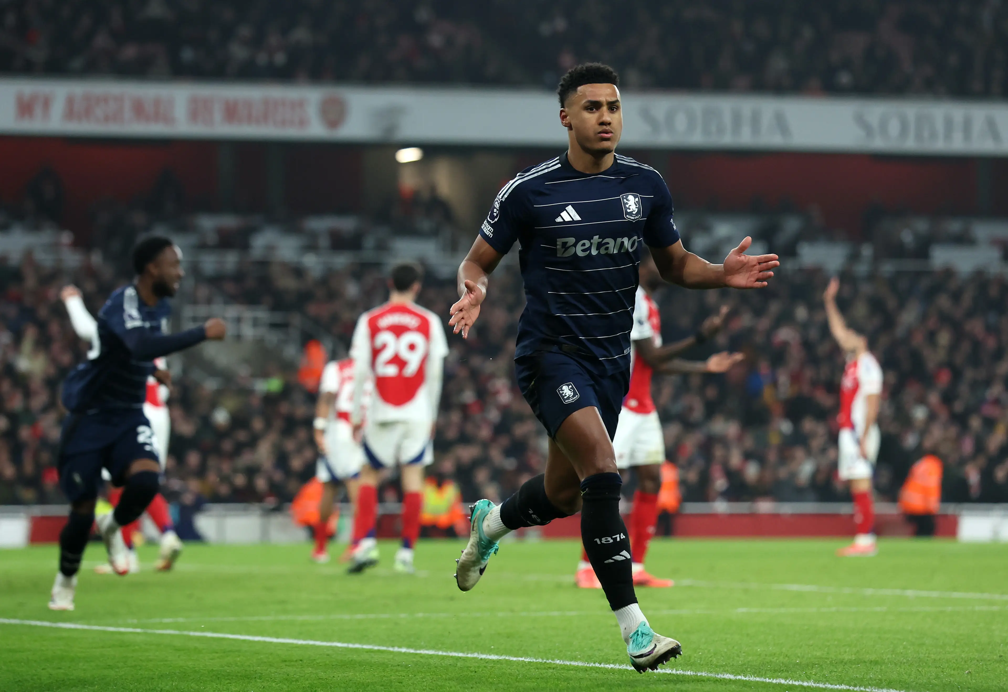 Ollie Watkins wheels away in celebration after scoring against Arsenal. Image: Getty 