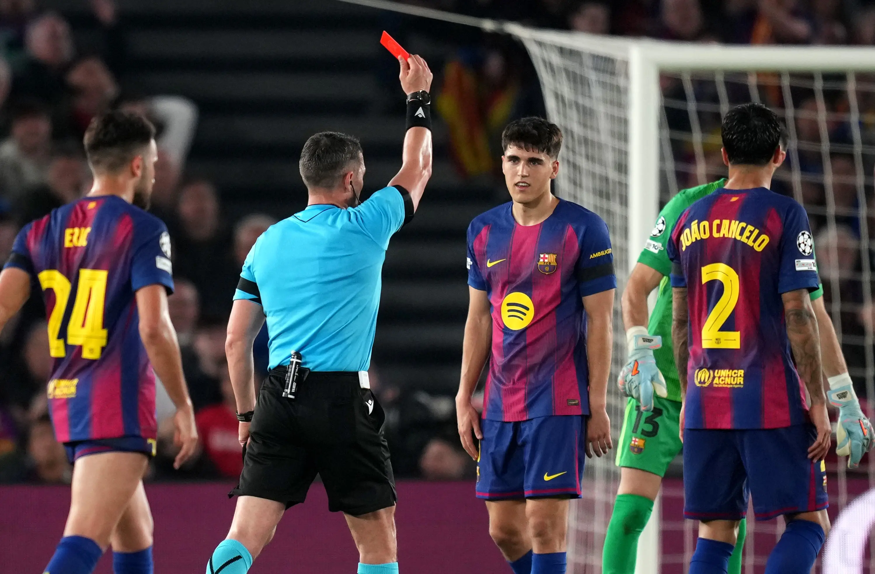 Referee Istvan Kovacs shows a red card to Pau Cubarsi of FC Barcelona following a VAR review after a challenge on Giuliano Simeone of Atletico de Madrid (Getty Images)