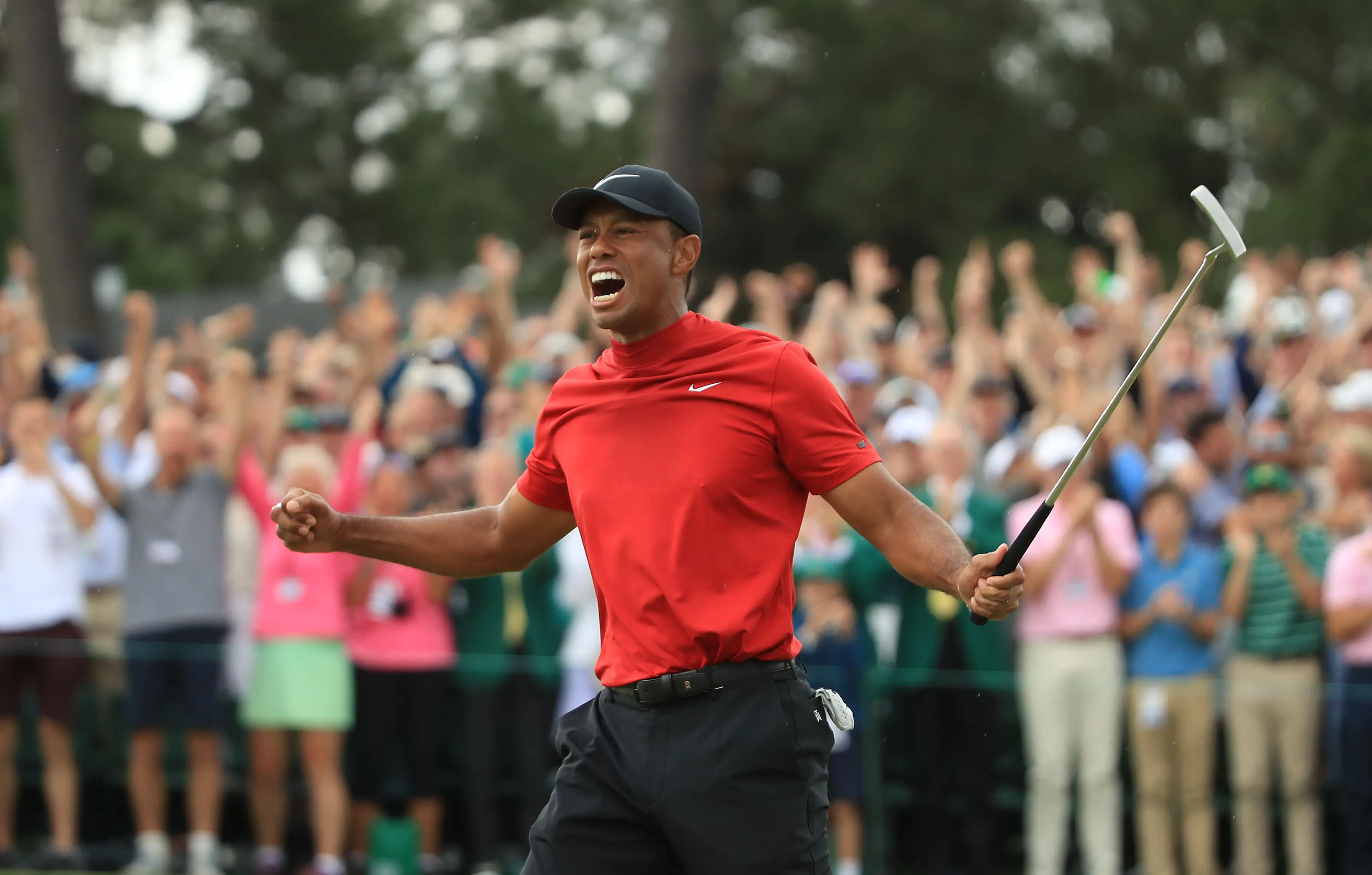 Tiger Woods (L) of the United States celebrates on the 18th green after winning the Masters at Augusta National Golf Club on April 14, 2019 in Augusta, Georgia. Getty Images
