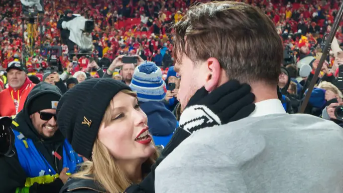 Taylor Swift and Travis Kelce embrace after the Chiefs' win