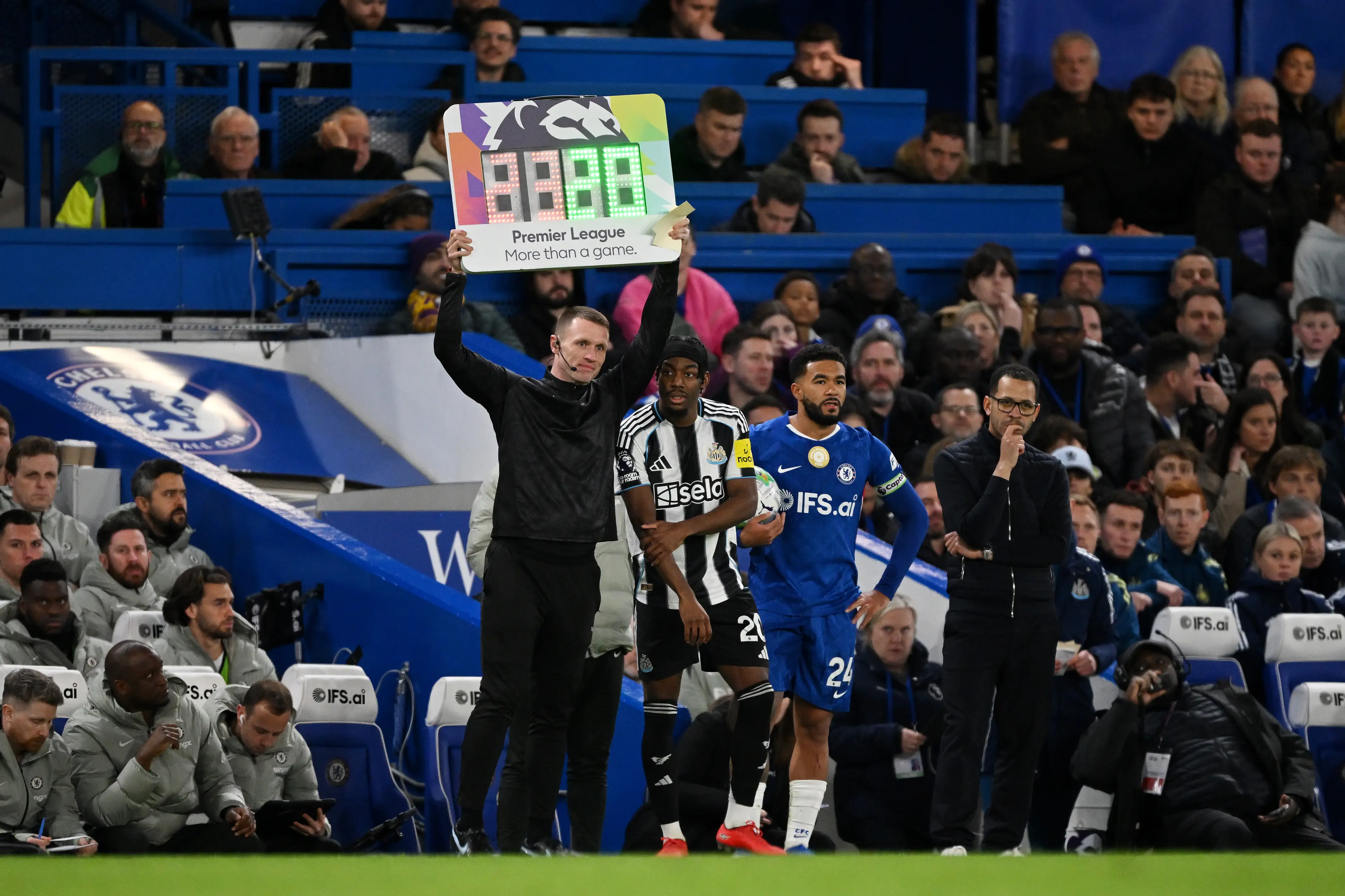 Fourth Official Tom Bramall holds up the Premier League More than a game substitution board during the Premier League match between Chelsea and Newcastle United at Stamford Bridge on March 14, 2026 in London, England. (Getty Images)