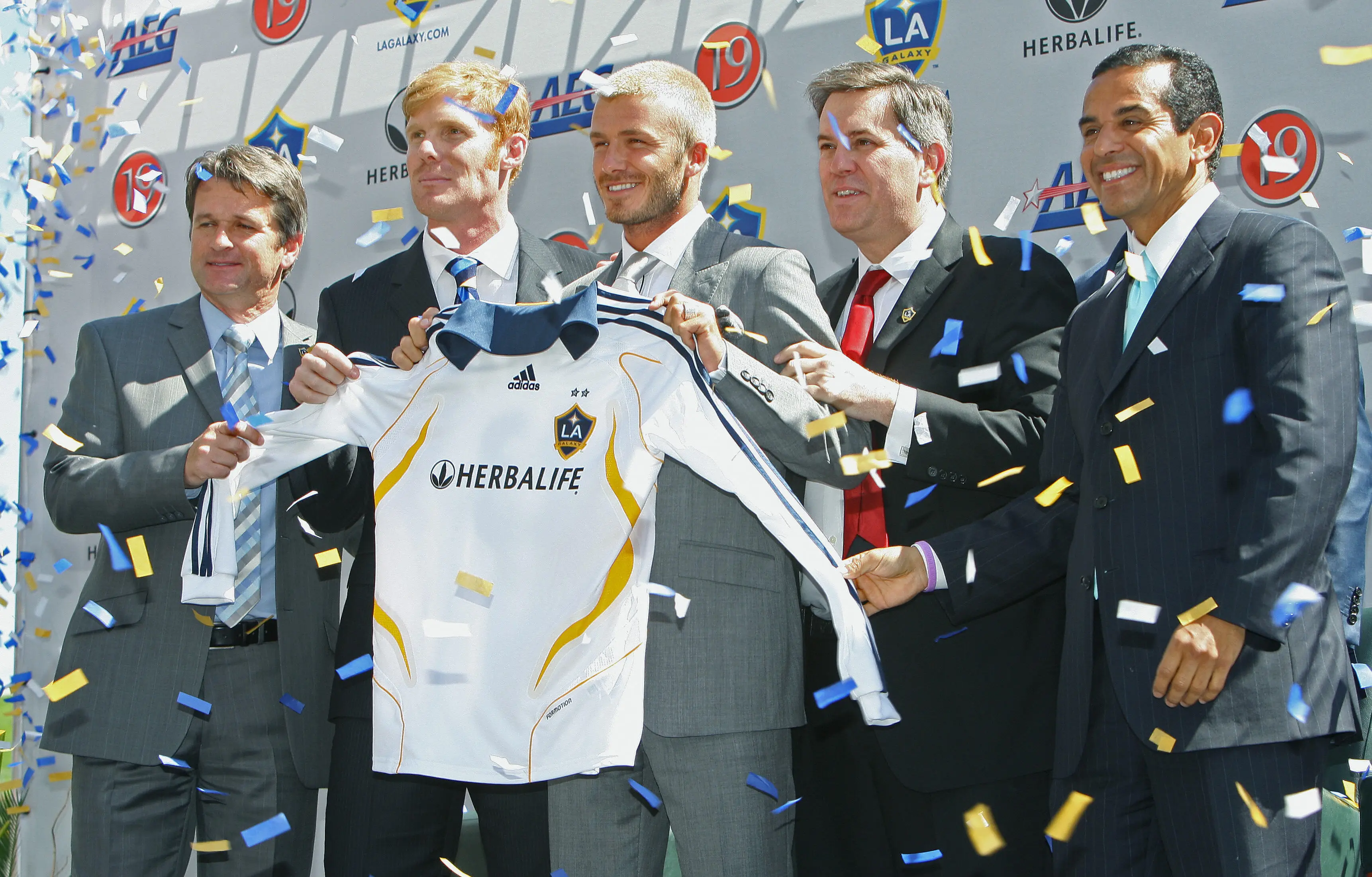 David Beckham holds up the now-iconic number 23 shirt during his LA Galaxy presentation. Image credit: Getty